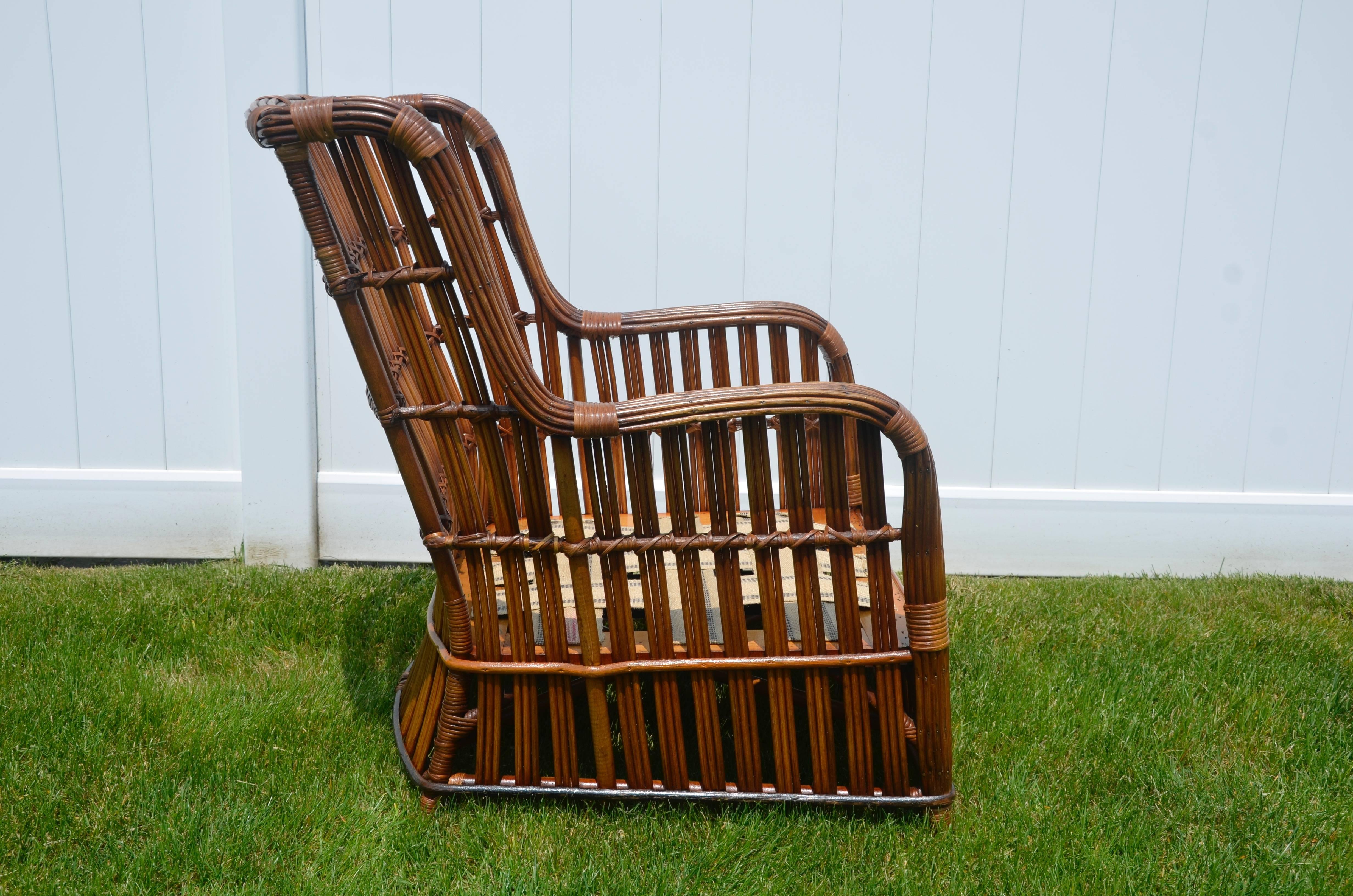 A beautiful stick rattan armchair in natural finish. This chair has a substantial hardwood frame with inset springs covered in fresh webbing. The pattern uses three rods of rattan instead of the usual two seen in most stick wicker giving the piece a