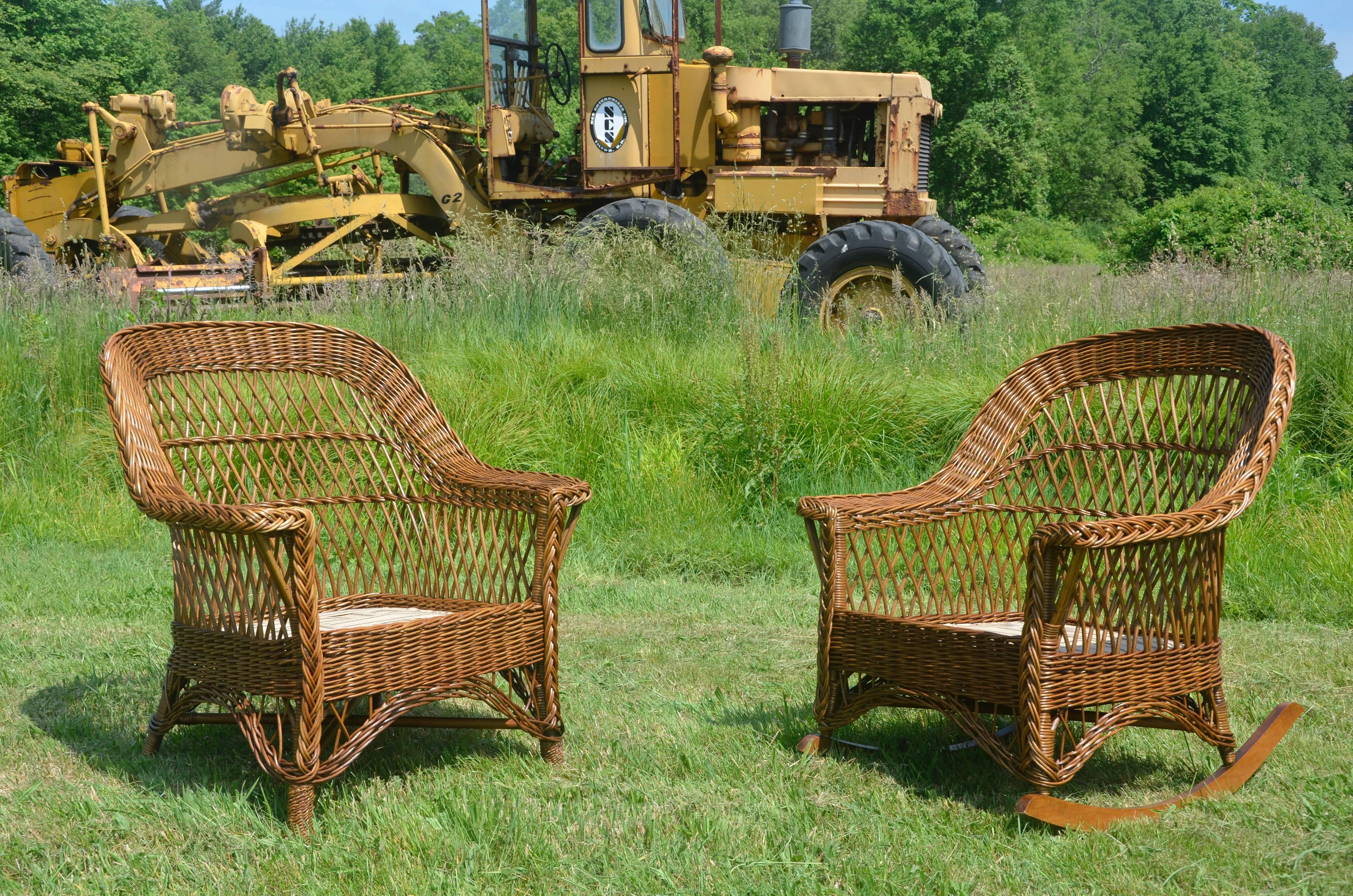 Antique Heywood-Wakefield bar harbor chair and rocker in natural finish. Large-scale and comfortable, this is a hard to find matched set signed with their ivory label. Fresh webbing covers the spring platform. These pieces are ready for custom