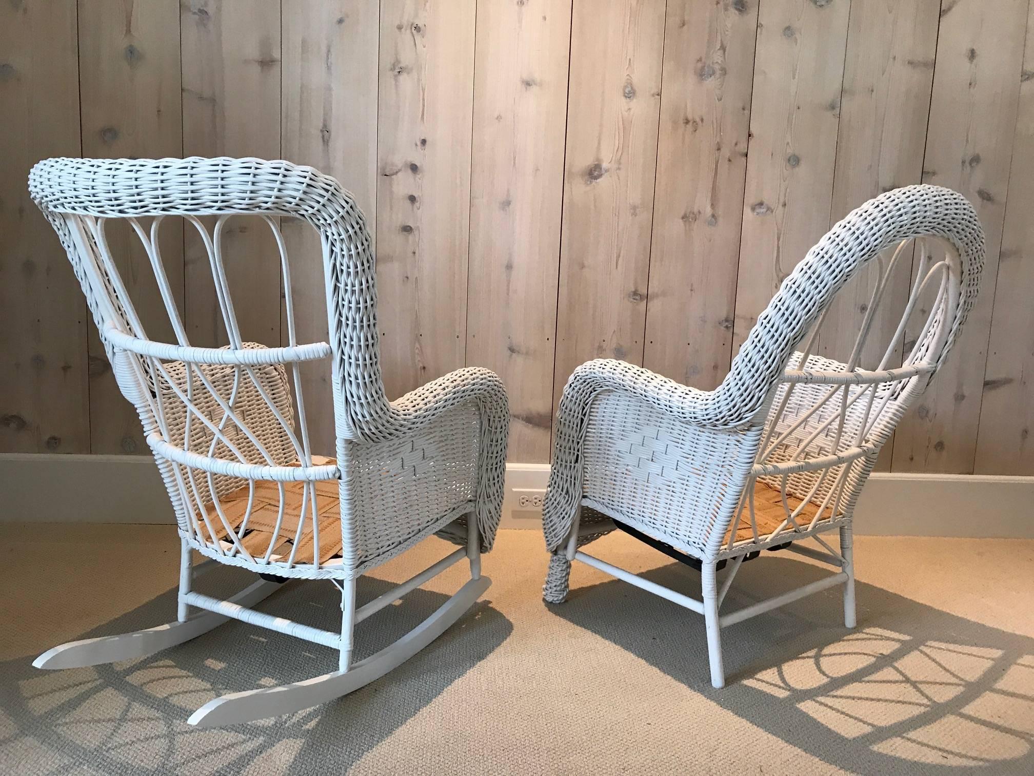 Beautiful Victorian wicker chair and rocker woven of reed in fresh white paint. The back of these chairs would have originally had an upholstered piece tacked into the frame. A lovely and clean set.
Chair measures 27