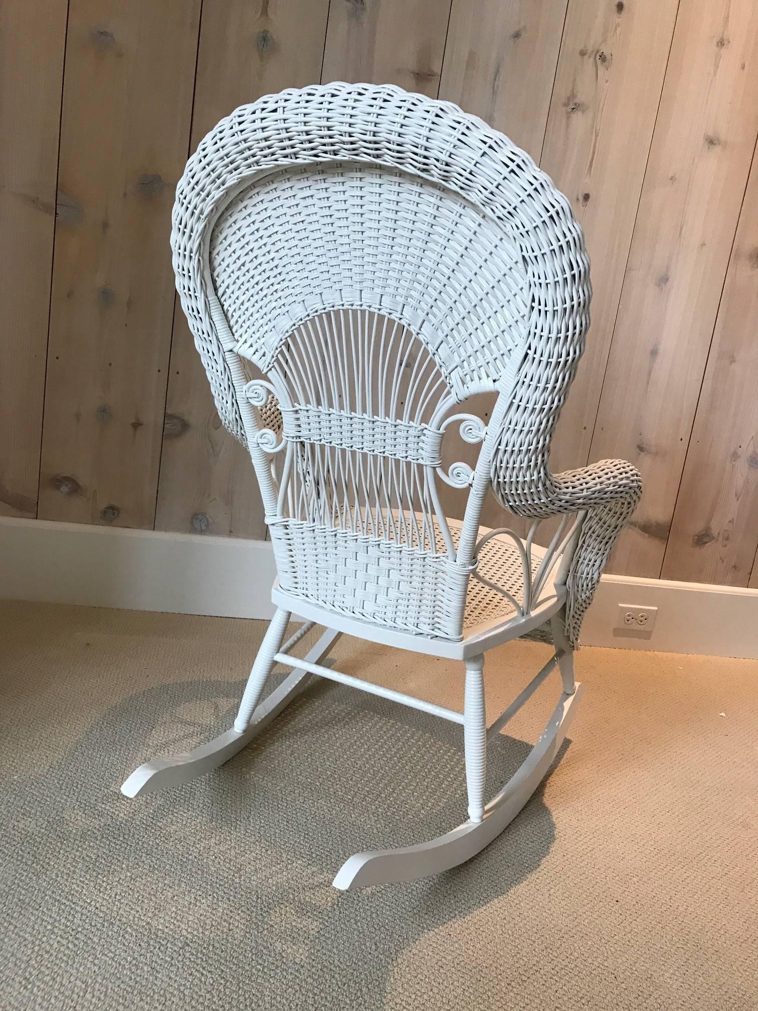 Beautiful Victorian Wicker Rocker in fresh white paint. Rocker measures 26