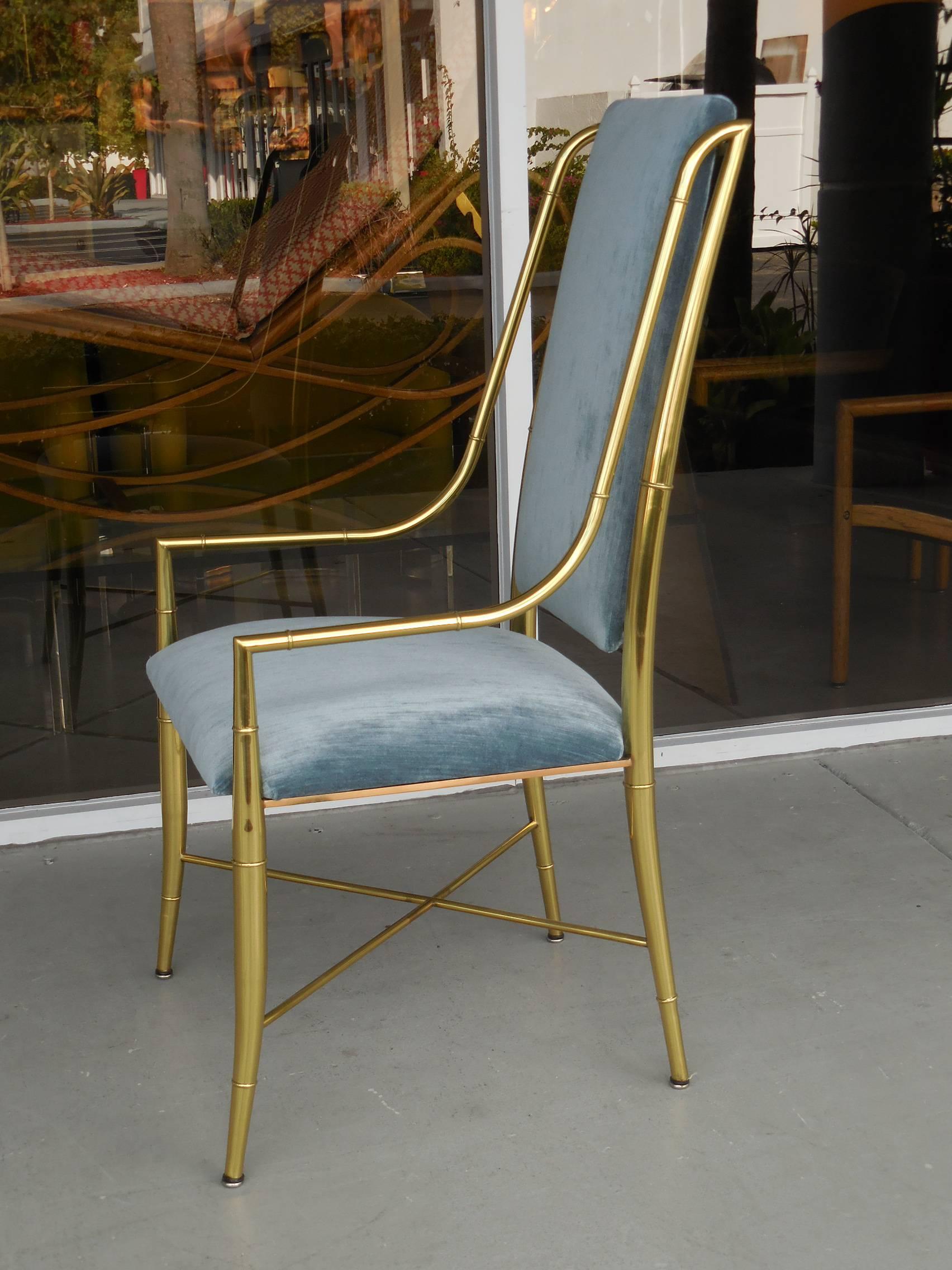 Very fluid lines and elegant proportions. A set of eight chairs. Polished brass frames and upholstered seat and back.