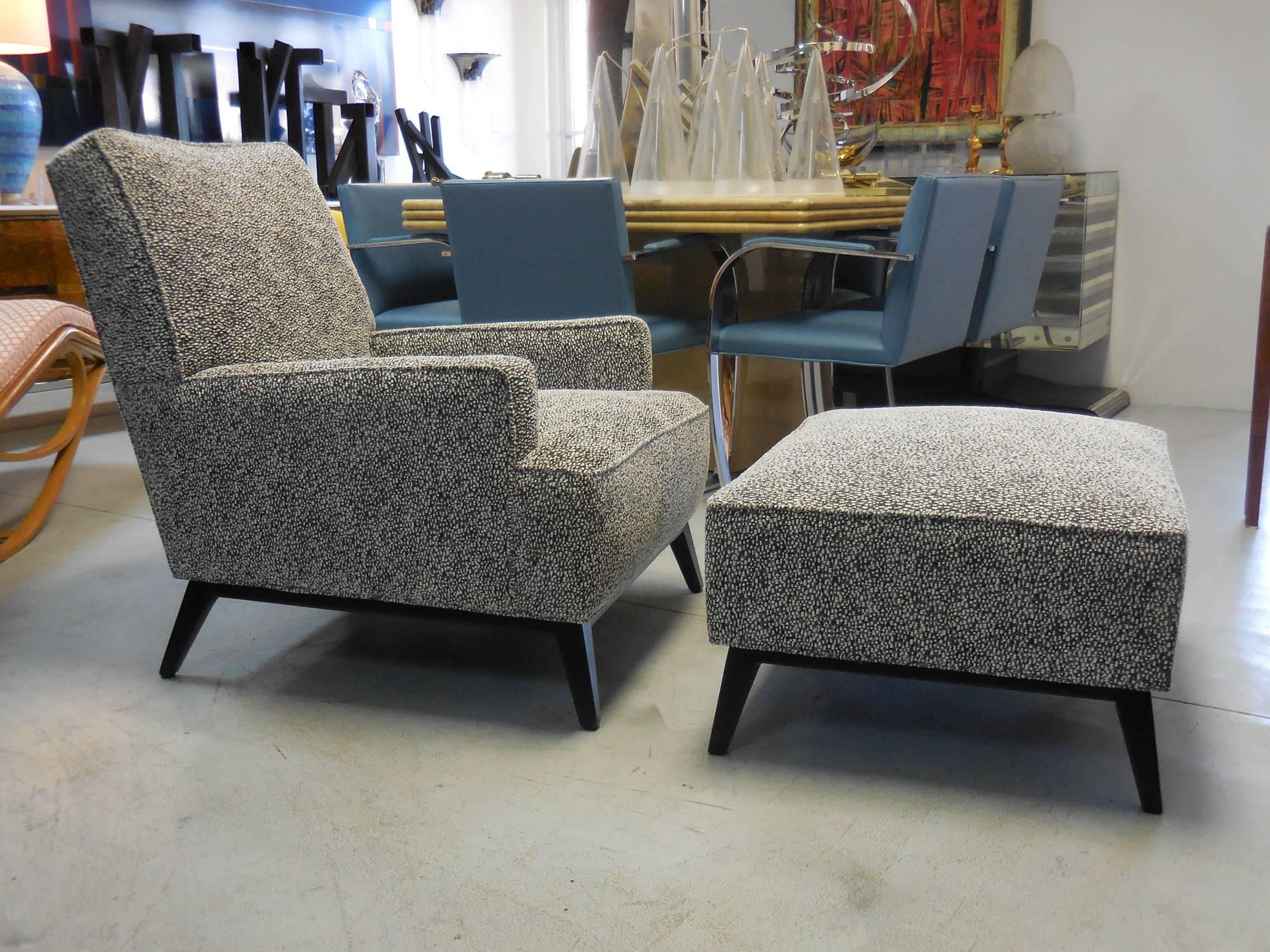 Great looking lounge chair and ottoman. Ebonized wood bases with unspected sprayed legs.