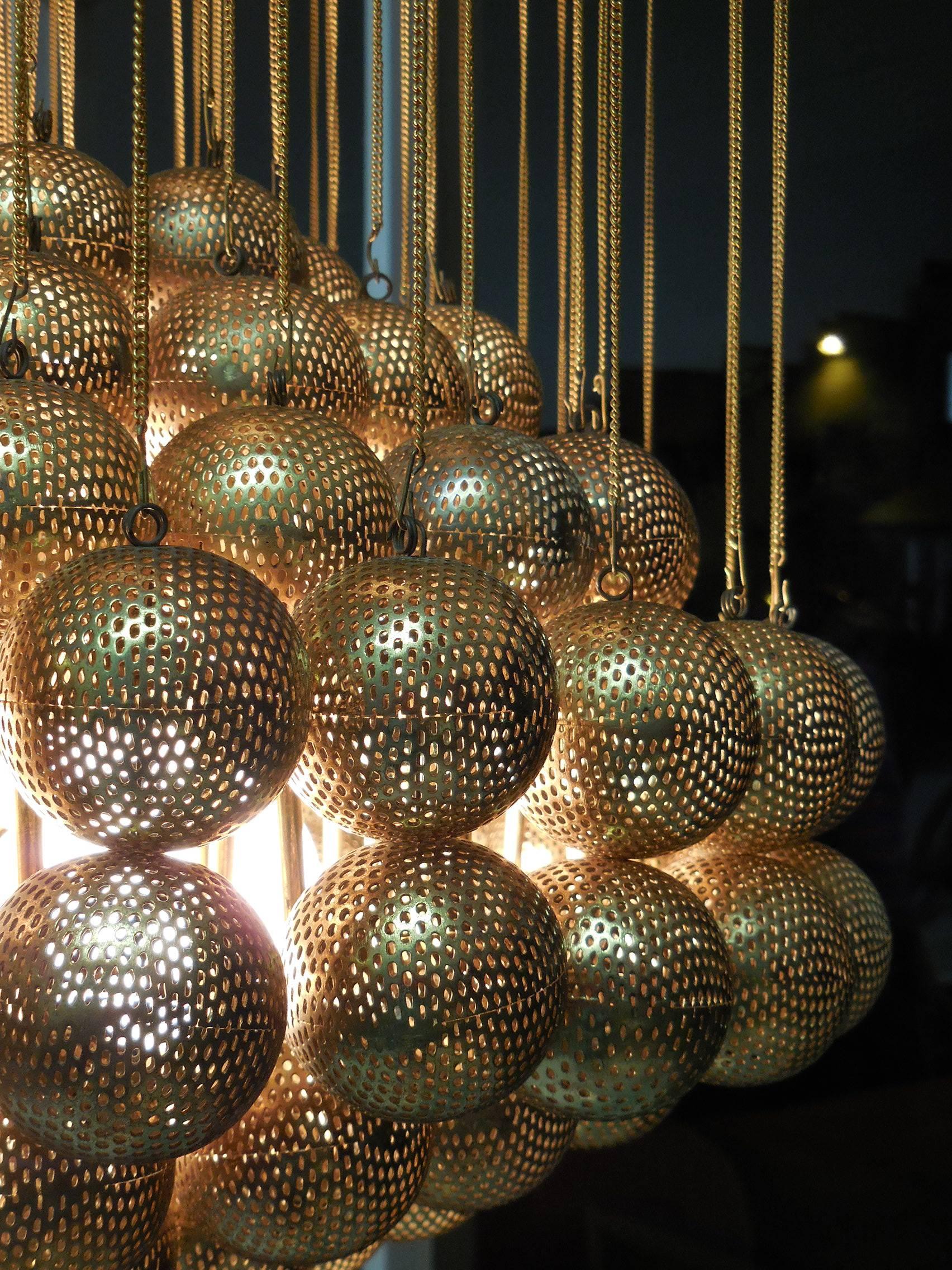 Large Brass Chandelier with Perforated Spheres by Zero Quattro In Excellent Condition In Miami, FL