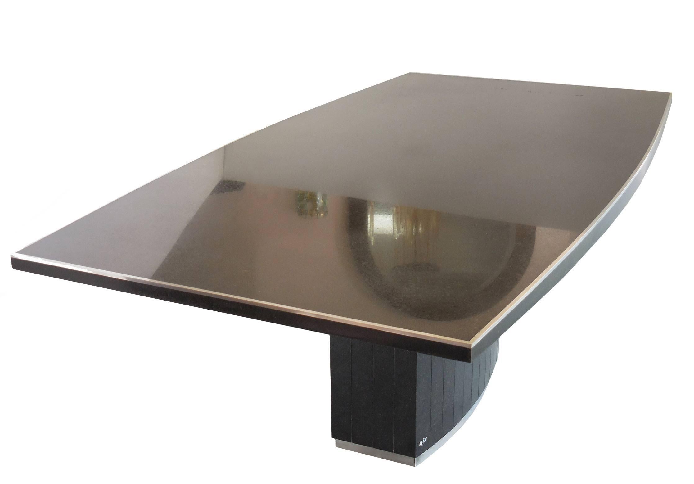 Stunning table by Willy Rizzo. Black granite with stainless steel trim. Note the subtle elliptical shape of the top. Signed "Willy Rizzo" on base.
