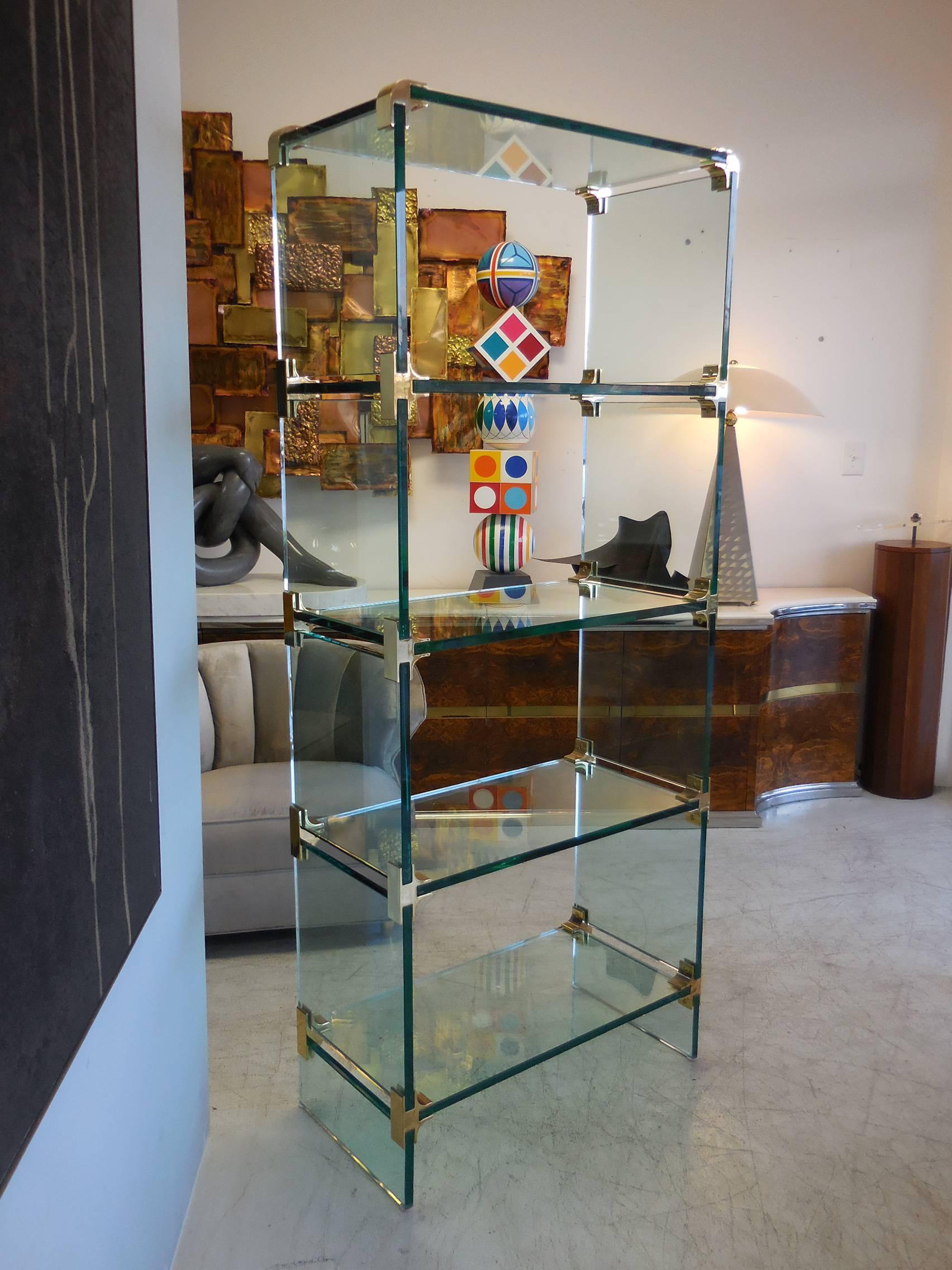 This is a beautiful piece of furniture by Pace Collection. Pieces of 3/4 inch glass are held in place by thick brackets. The look is robust and light, all at once.