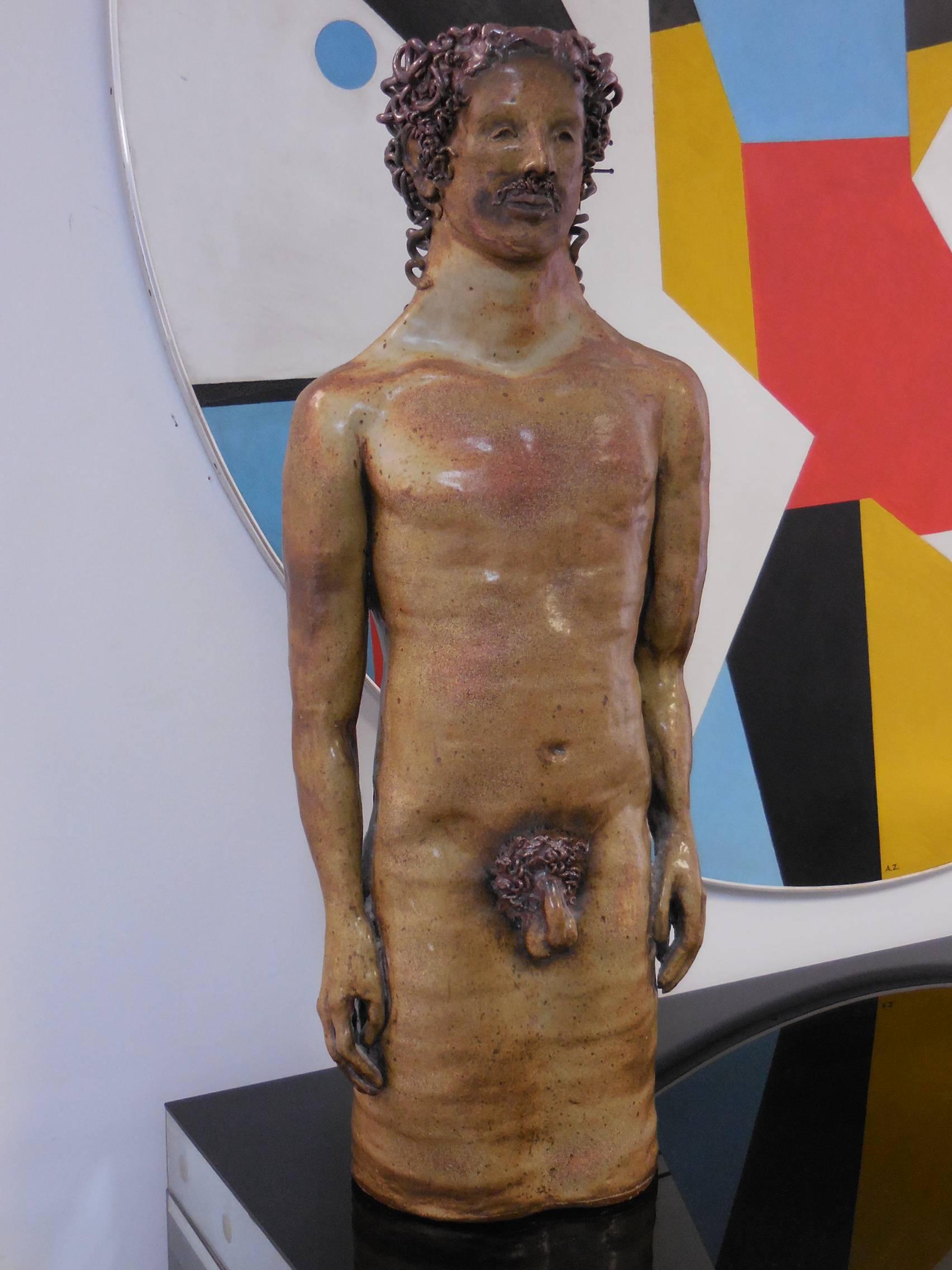 This is a very large ceramic piece. A nude male, expertly done in a naive style.
Apparently unsigned.  
