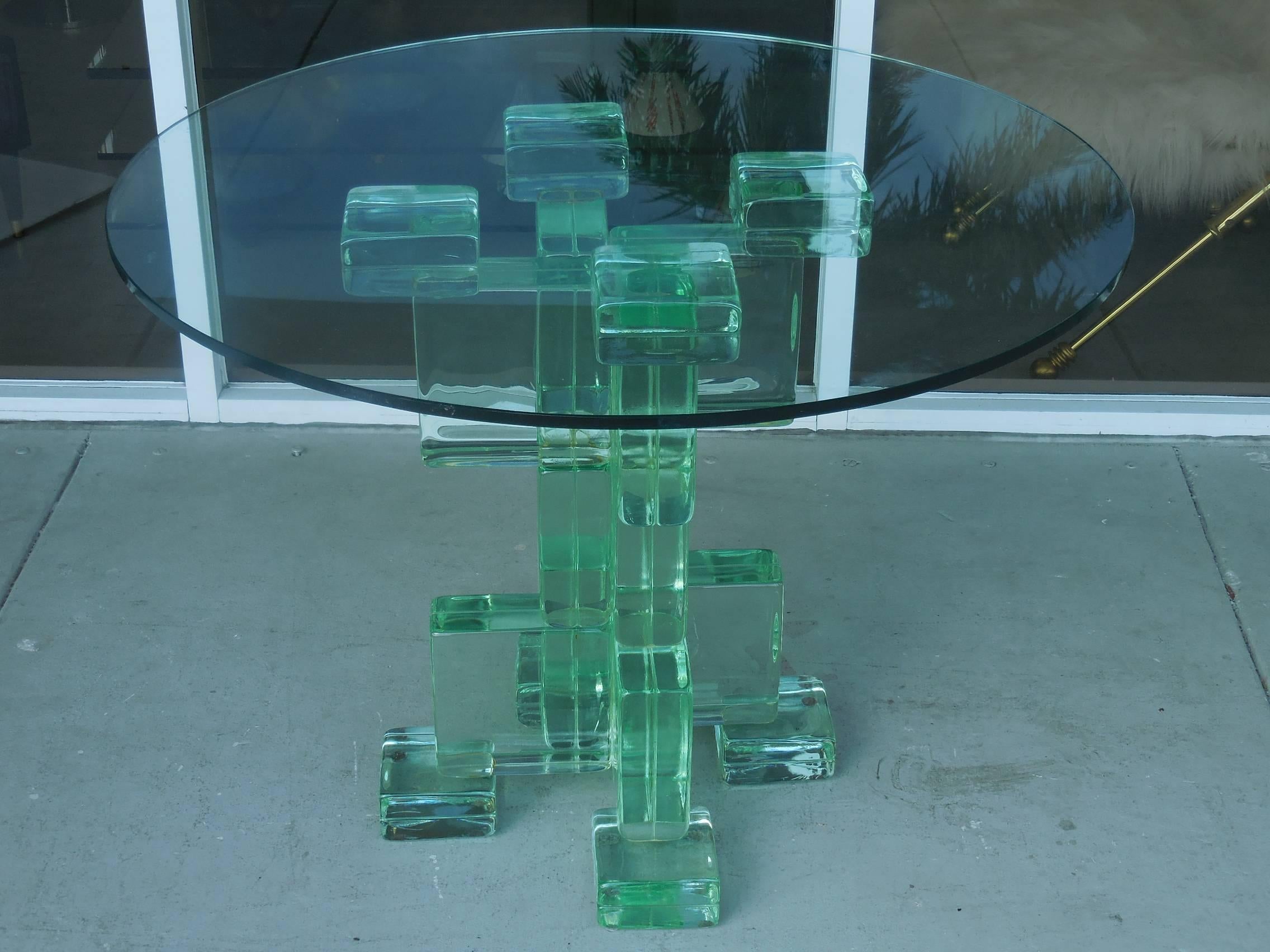 Great looking table. Made of thick clear glass blocks arranged in a random upward manner. The glass blocks have a subtle green color to them.
Presented with a 39