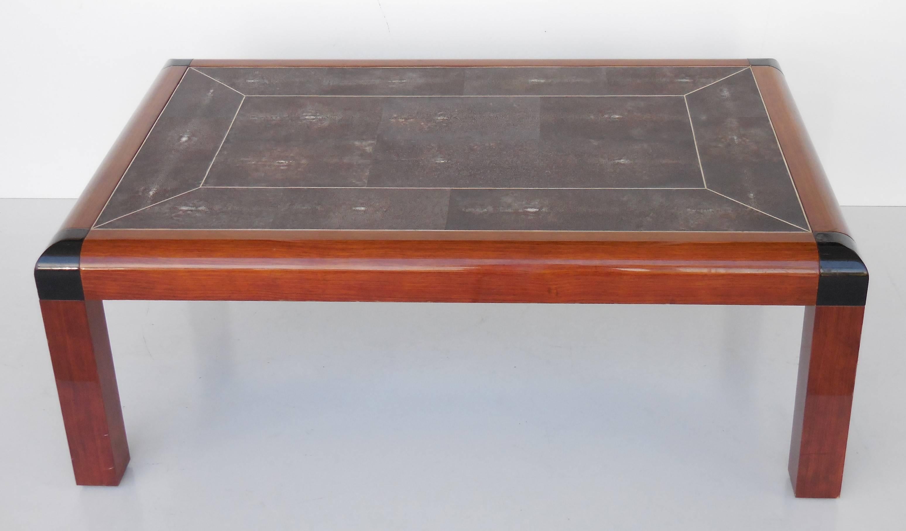 A rare coffee table by Karl Springer. Beautiful shagreen top with a thick solid wood frame, corners are lacquered. Signed and dated underneath.