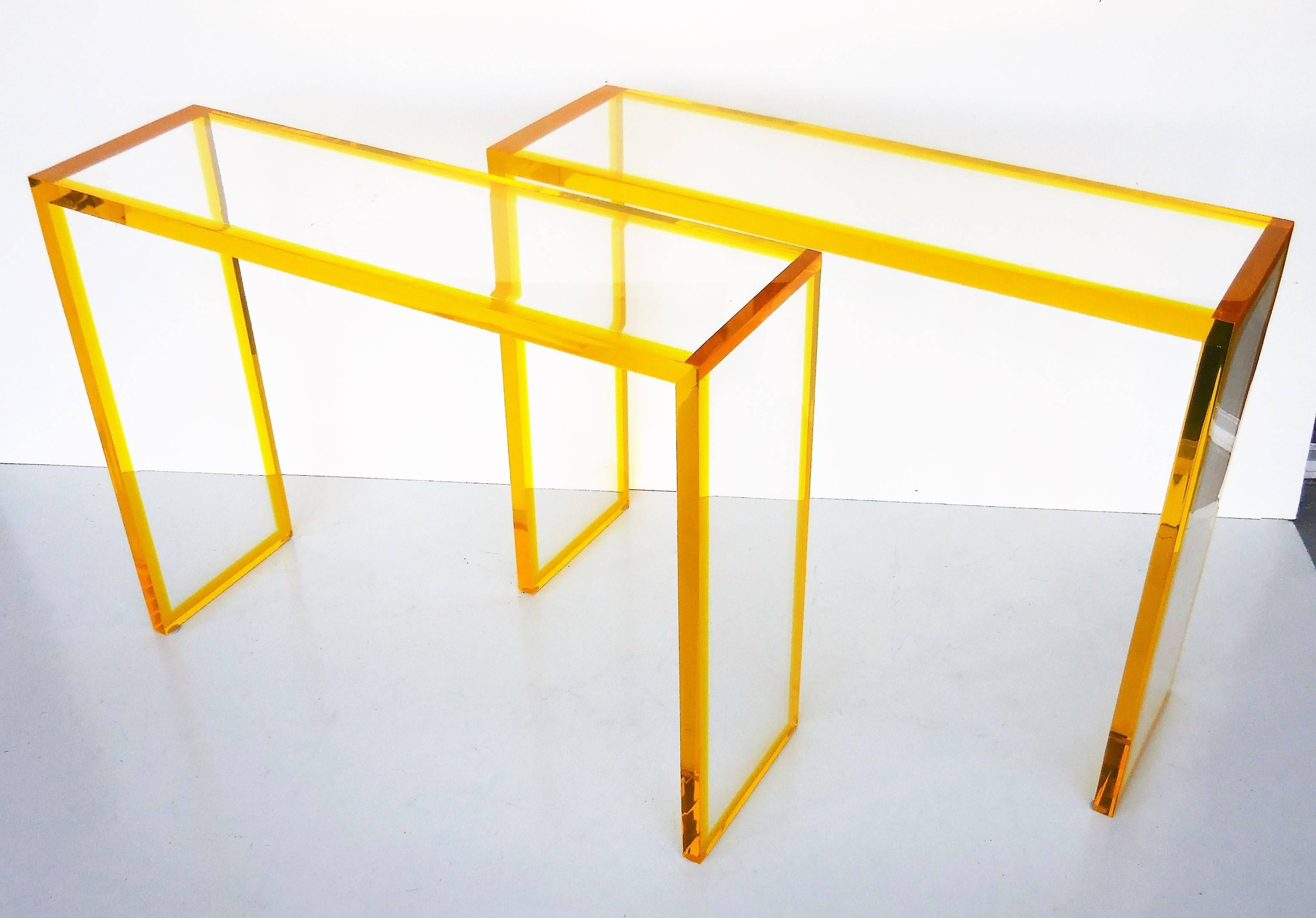 Unique pair of consoles, thick acrylic construction. All the edges are bright yellow acrylic. Available individually or as a pair.