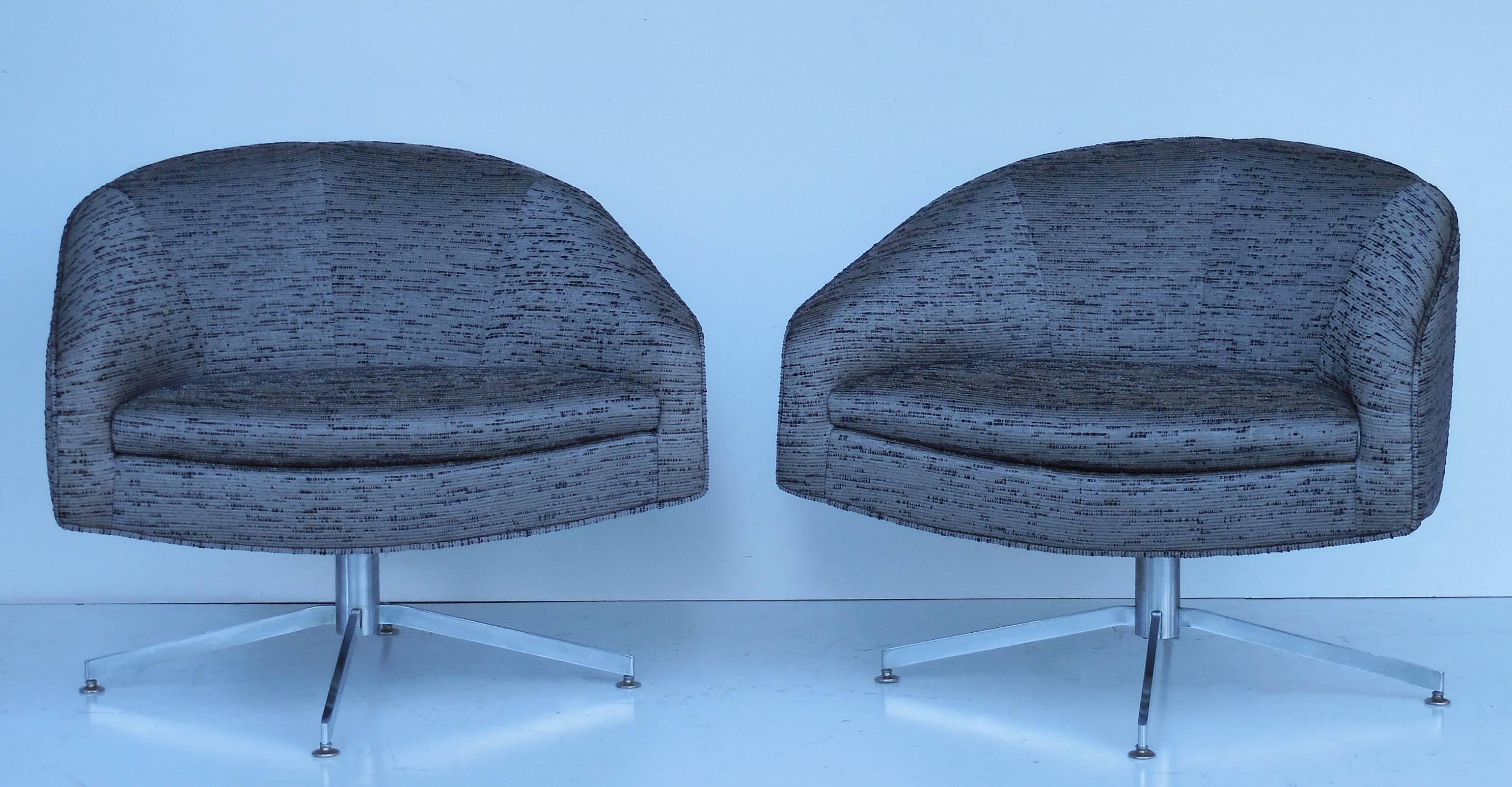 Pair of swivel chairs on chrome bases by Milo Baughman. Low profile design.