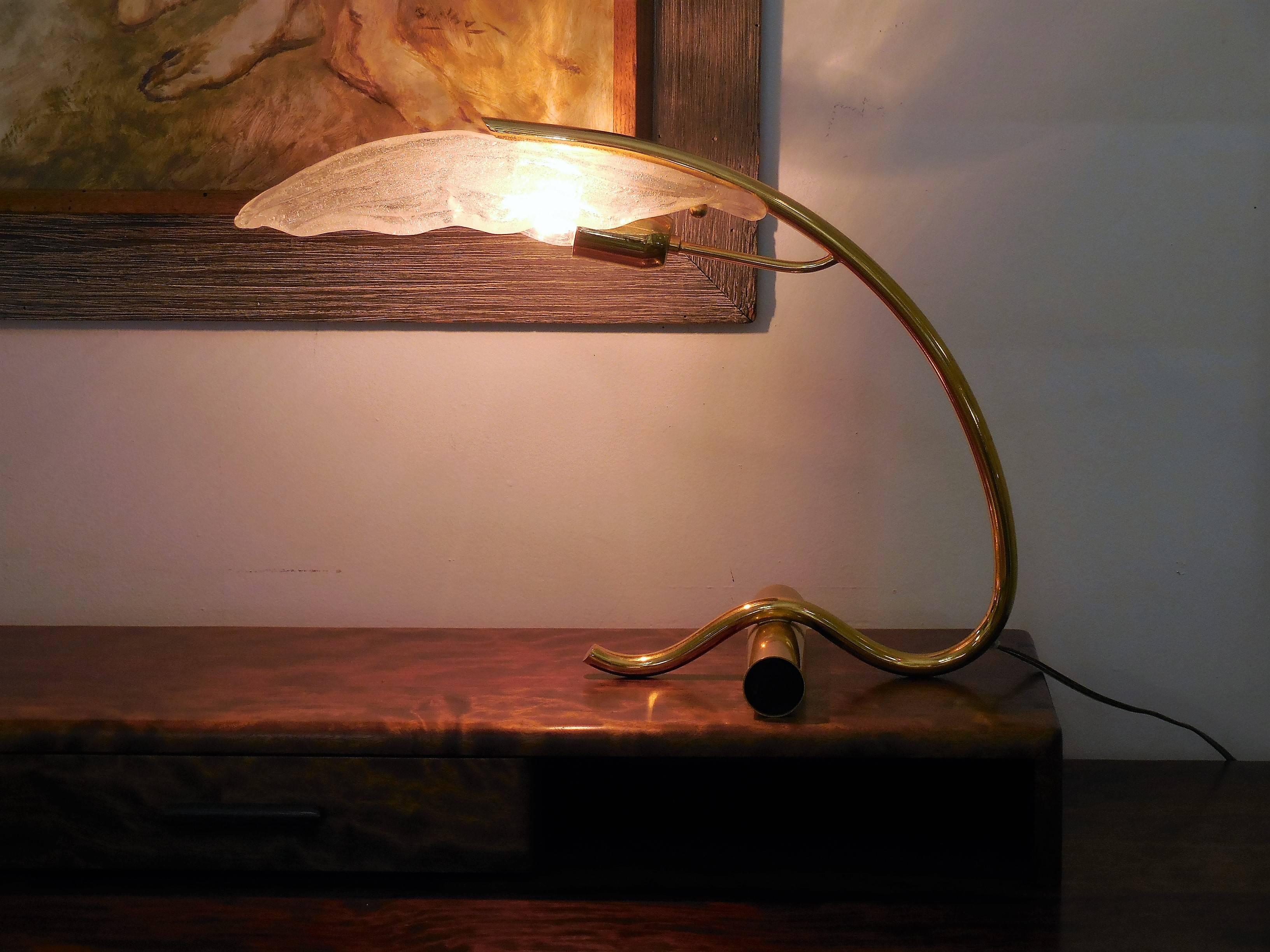 A most unusual and beautiful desk lamp. Thick Murano glass diffuser attached to a graceful base. Retains makers tag. Looks incredible both on and off.
