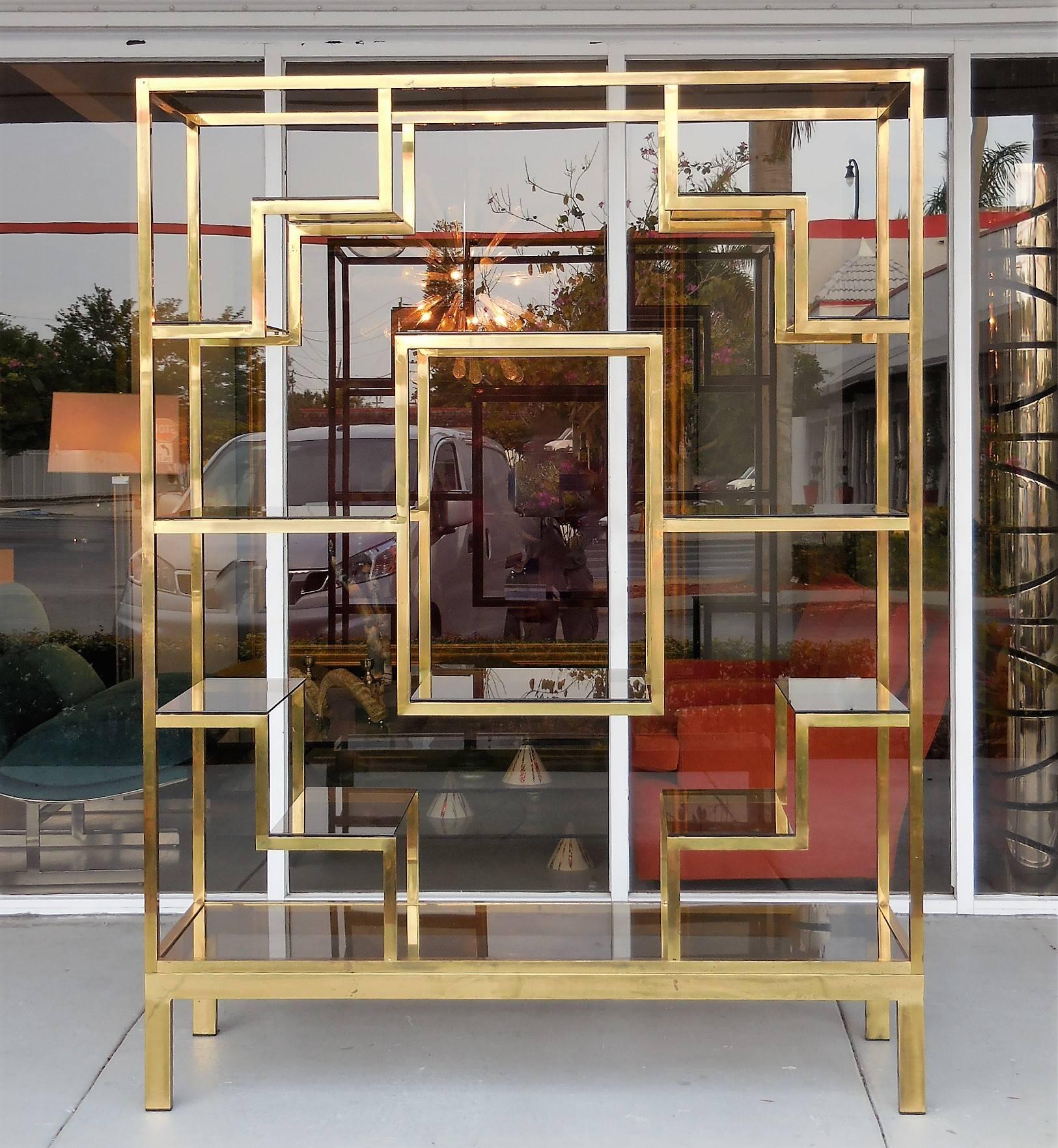 A brass Italian étagère with glass shelves. Very practical and great looking. Can be used as a room divider as well.