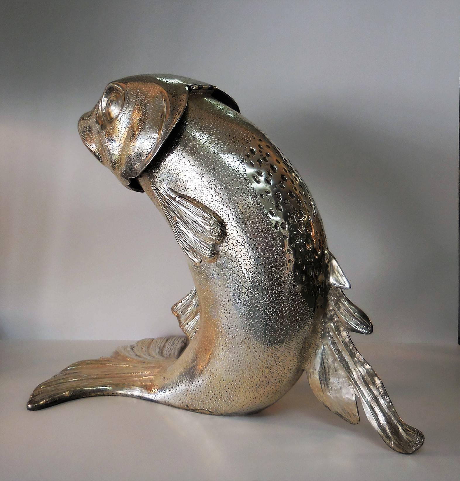 Silver plated bronze fish of monumental size, the head is hinged and reveals a removable bucket. Nice detail and stunning to say the least.