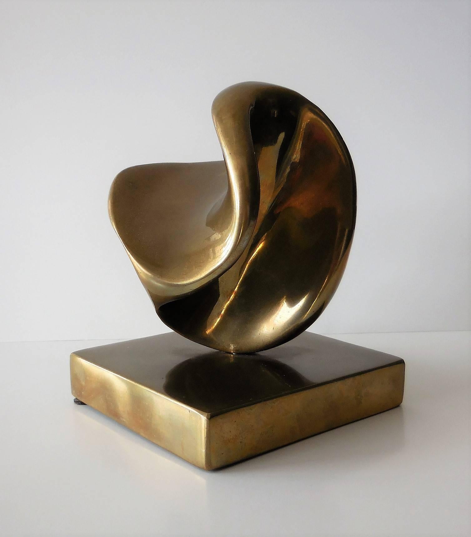 This spectacular sculpture is solid bronze, mounted on a bronze base. The biomorphic shape is different from every angle. Quite a stunning piece of art. Signed and numbered, 7/100.
