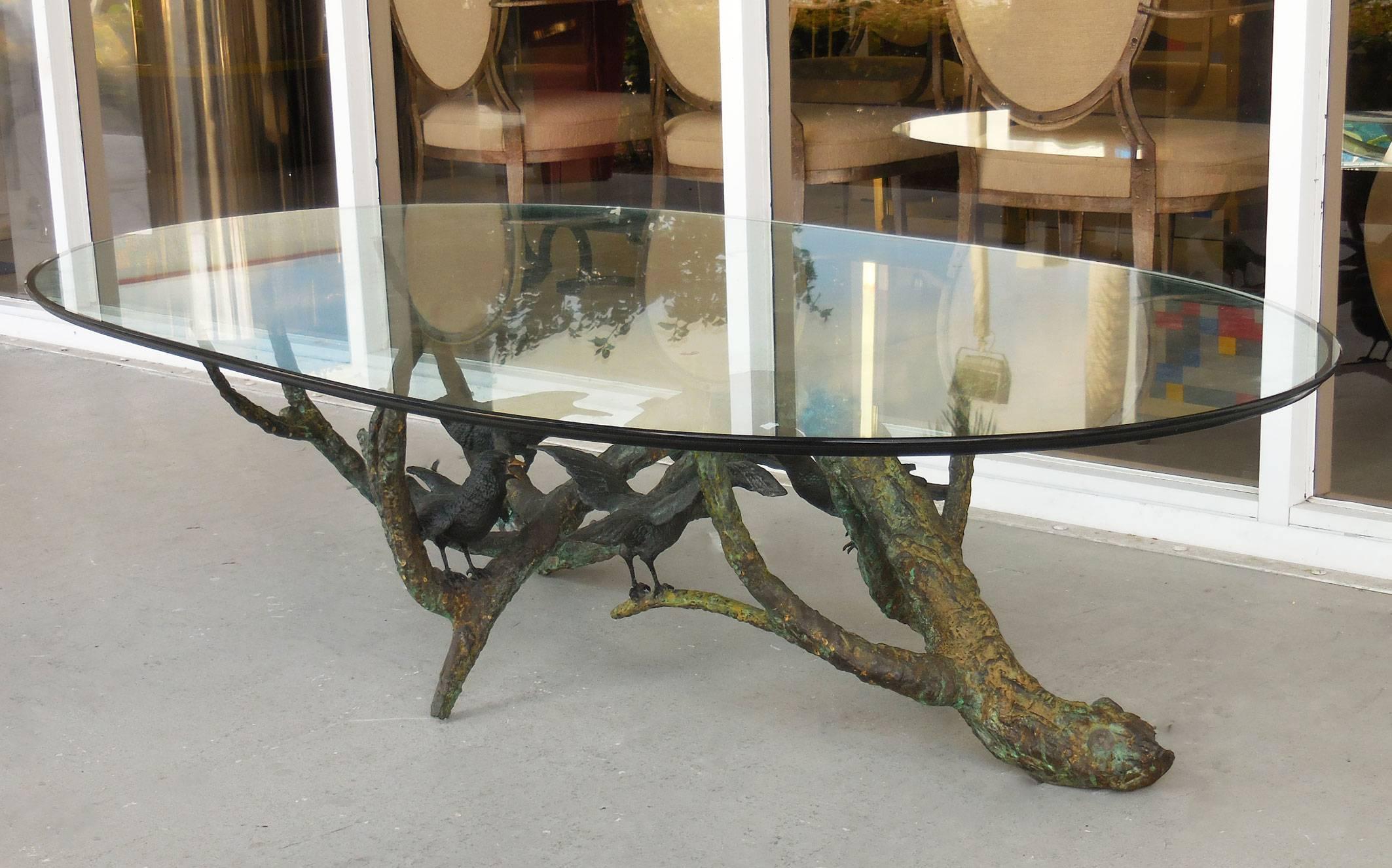 Spectacular to say the least. A large bronze branch with birds perched on it. Large and quite rare, highly detailed craftsmanship of the highest quality. Could be used as well with a rectangular glass top, original oval glass top included.