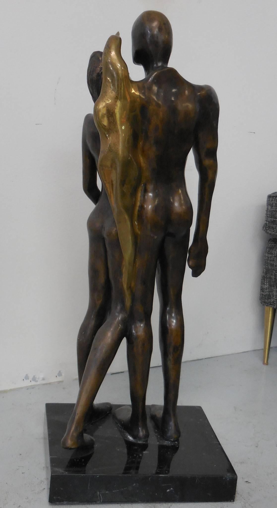 A large bronze sculpture with figures done in an stylized abstract manner. On a thick marble base. Signed illegible, dated '86, numbered 3/7.