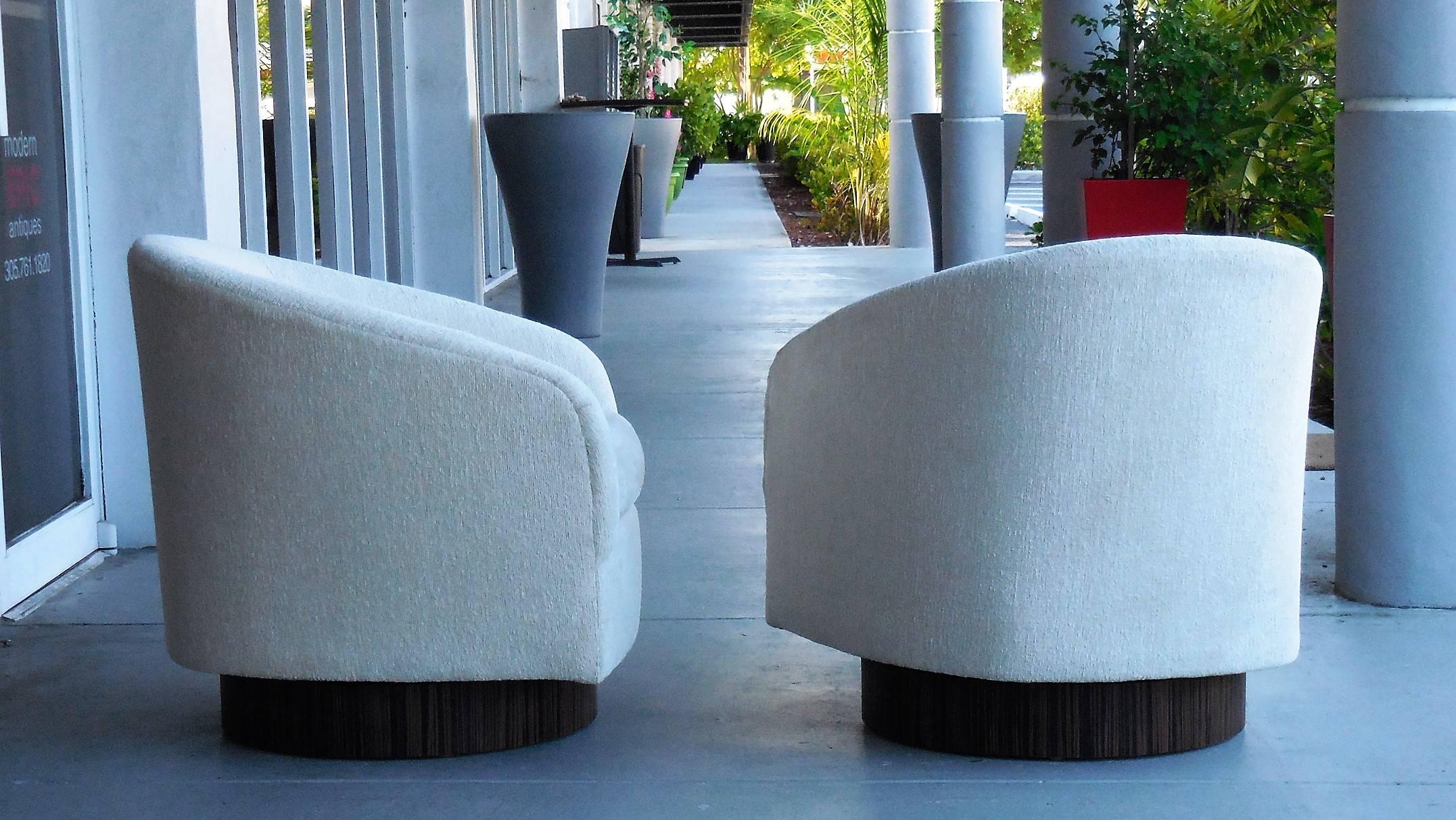 Super comfortable swivel chairs with Macassar bases.