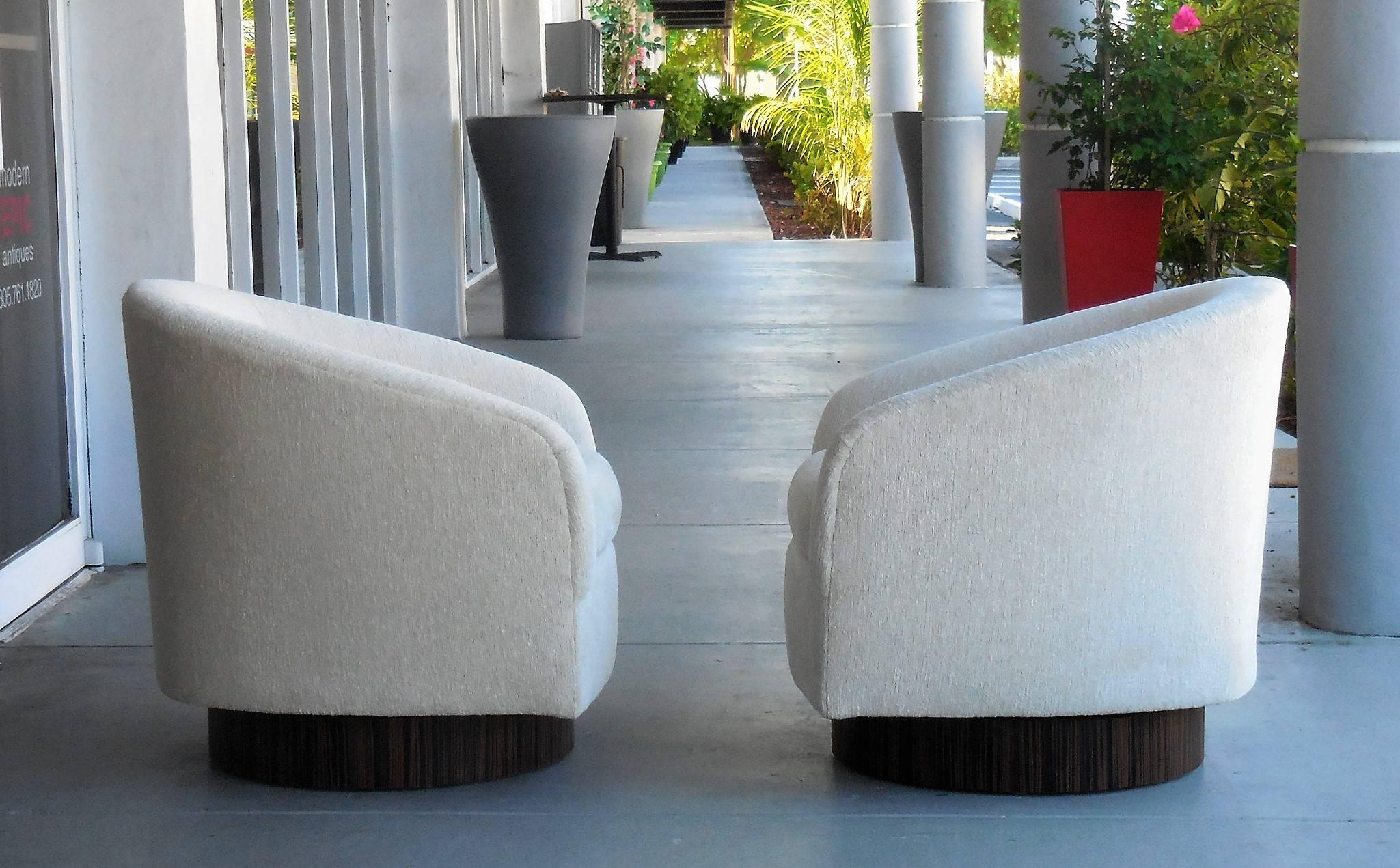 American Pair of Plush Swivel Chairs with Macassar Bases