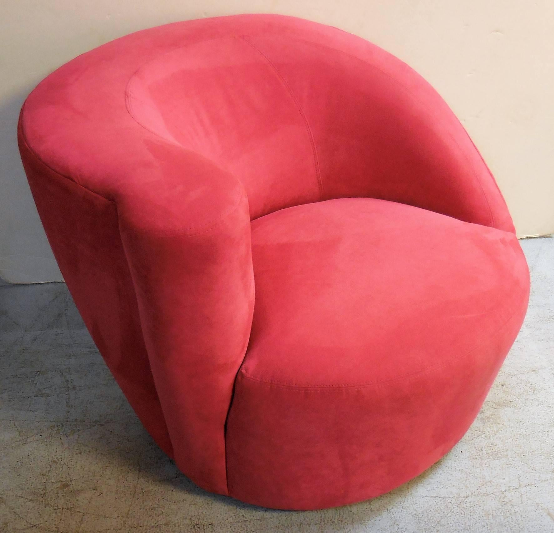 A pair of Nautilus swivel chairs by Vladimir Kagan. Super comfortable. The design is plush with interesting lines from any angle.