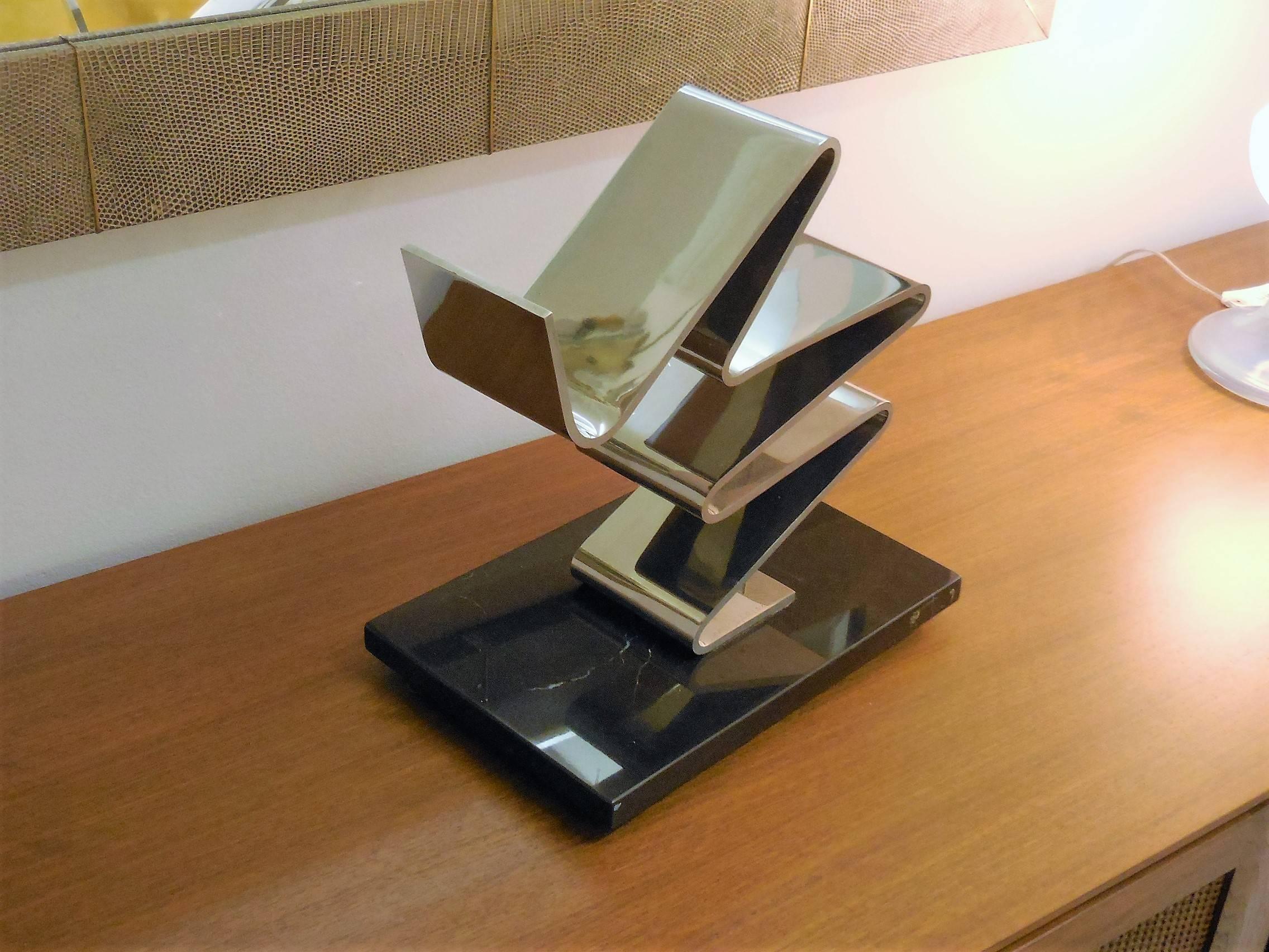 A great sculpture by american artist Kurt Larisch. It is stainless on marble base. Signed and numbered on the metal. 