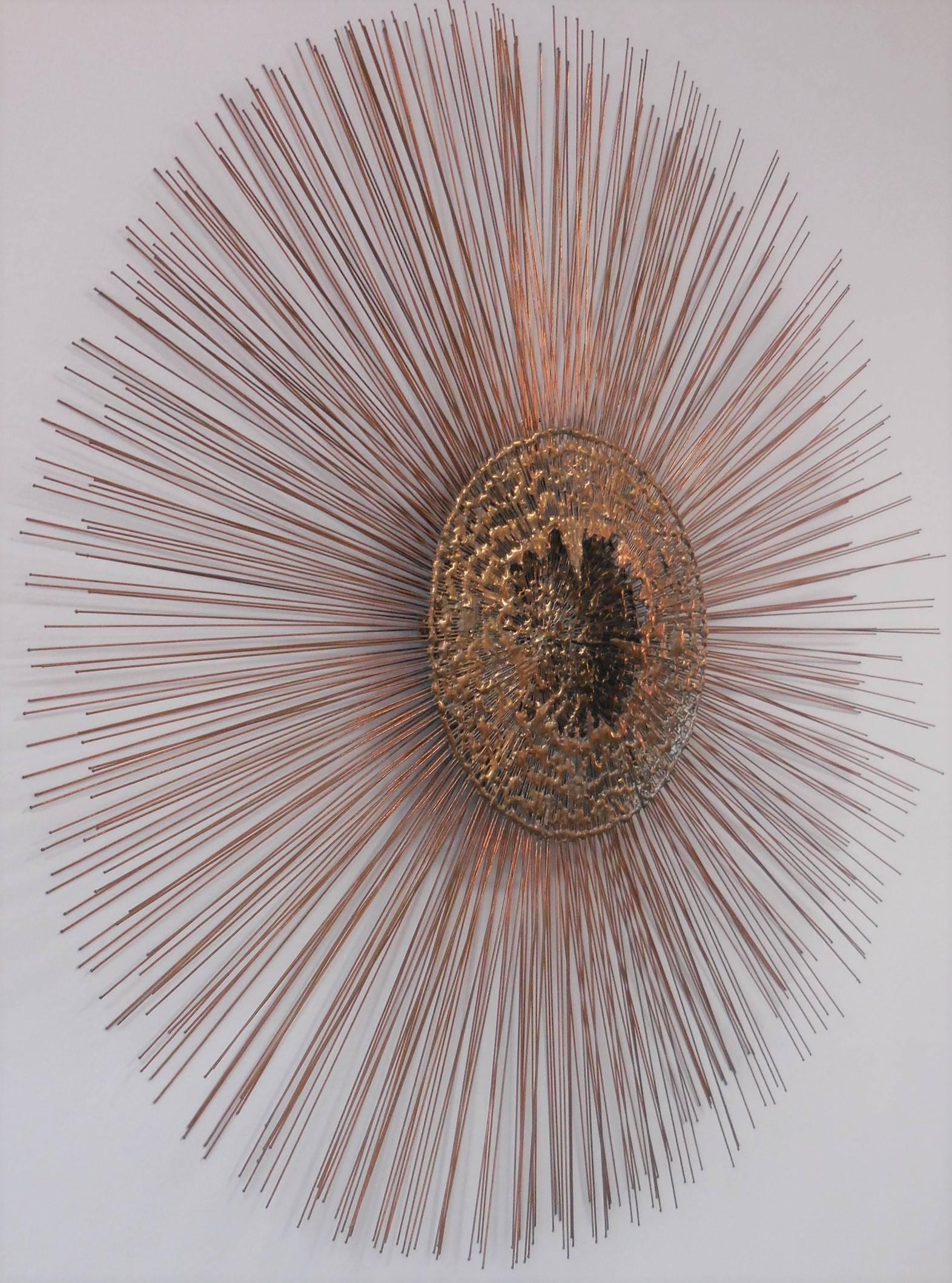 Large wall sculpture. This one has a two layer design with a large textural sculptural centre.
