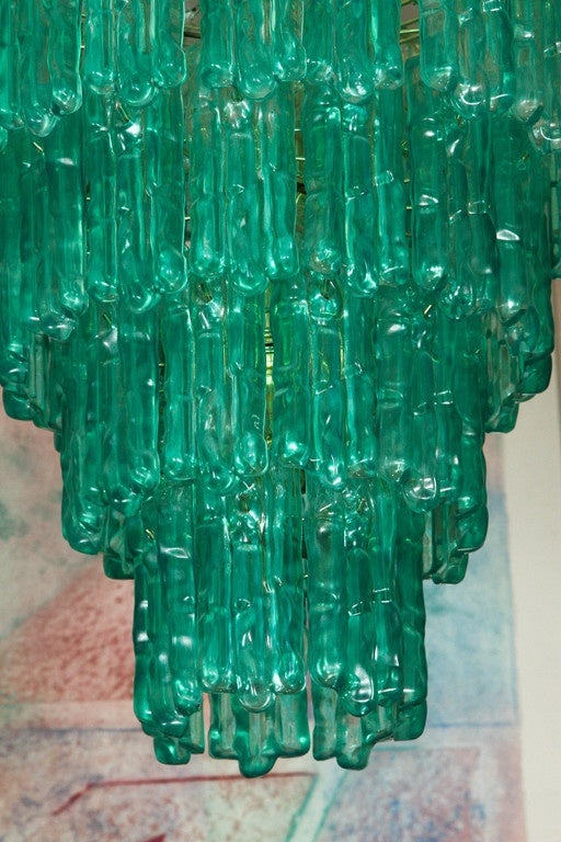 Mid-Century striking five- tier waterfall chandelier with emerald color lucite ice drops.