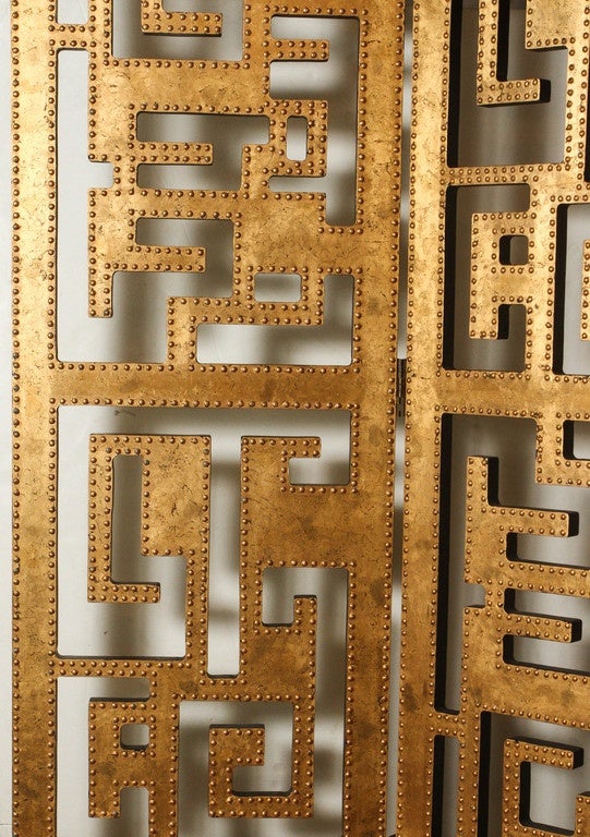 Solid wood screen in a gild gold finish, with an Asian influenced geometric pattern. Each panel measures 20