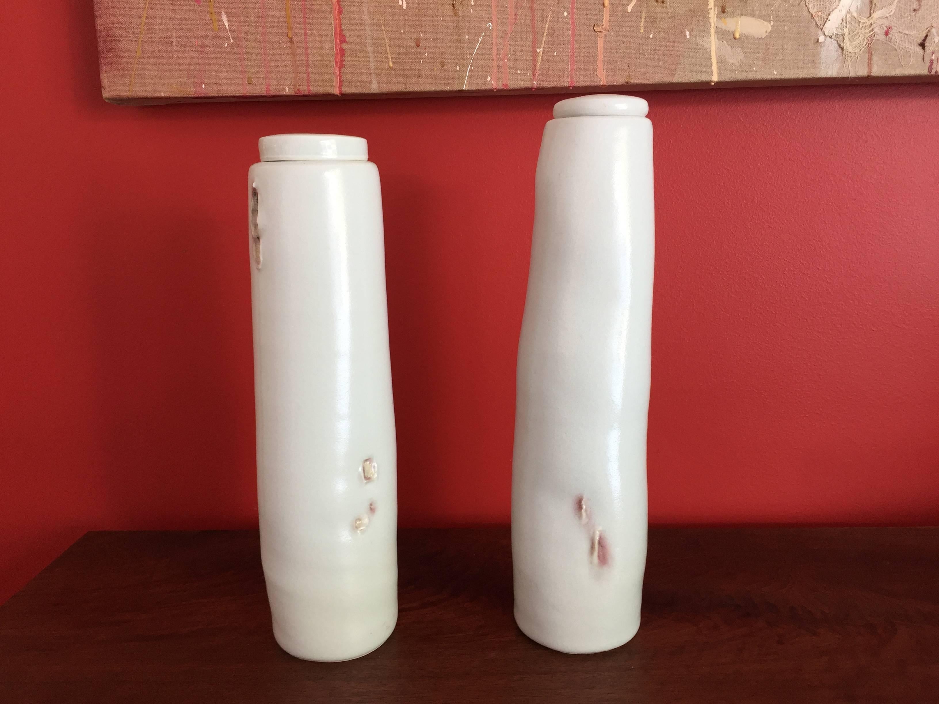 Two storage jars, 12.5'' + 13.25''

This is a rare opportunity to purchase a pair of jars from this artist. Each is made of porcelain, glazed in celadon with copper red embellishments.