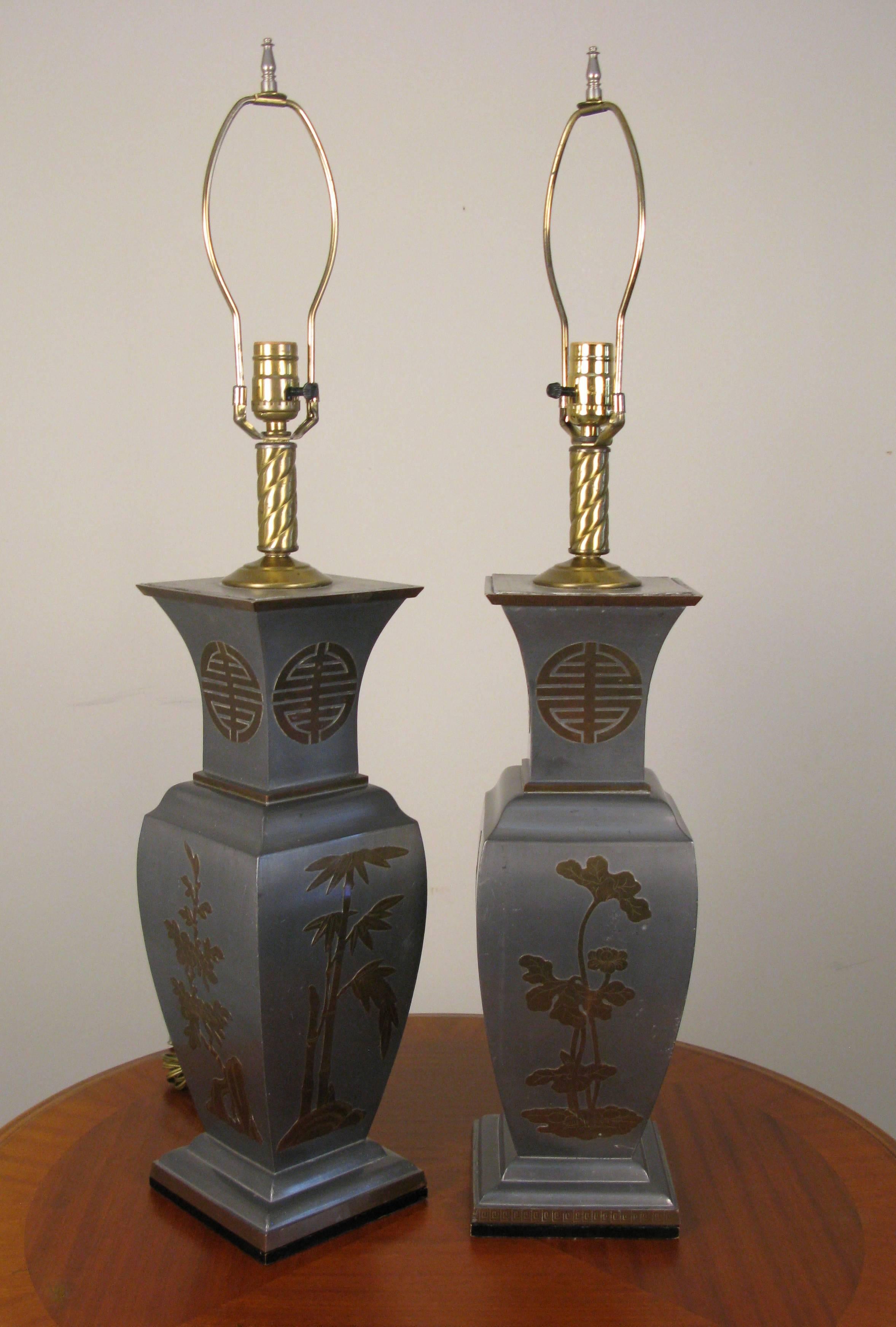 Bold pair of pewter and brass Asian influence table lamps. In the James Mont style.