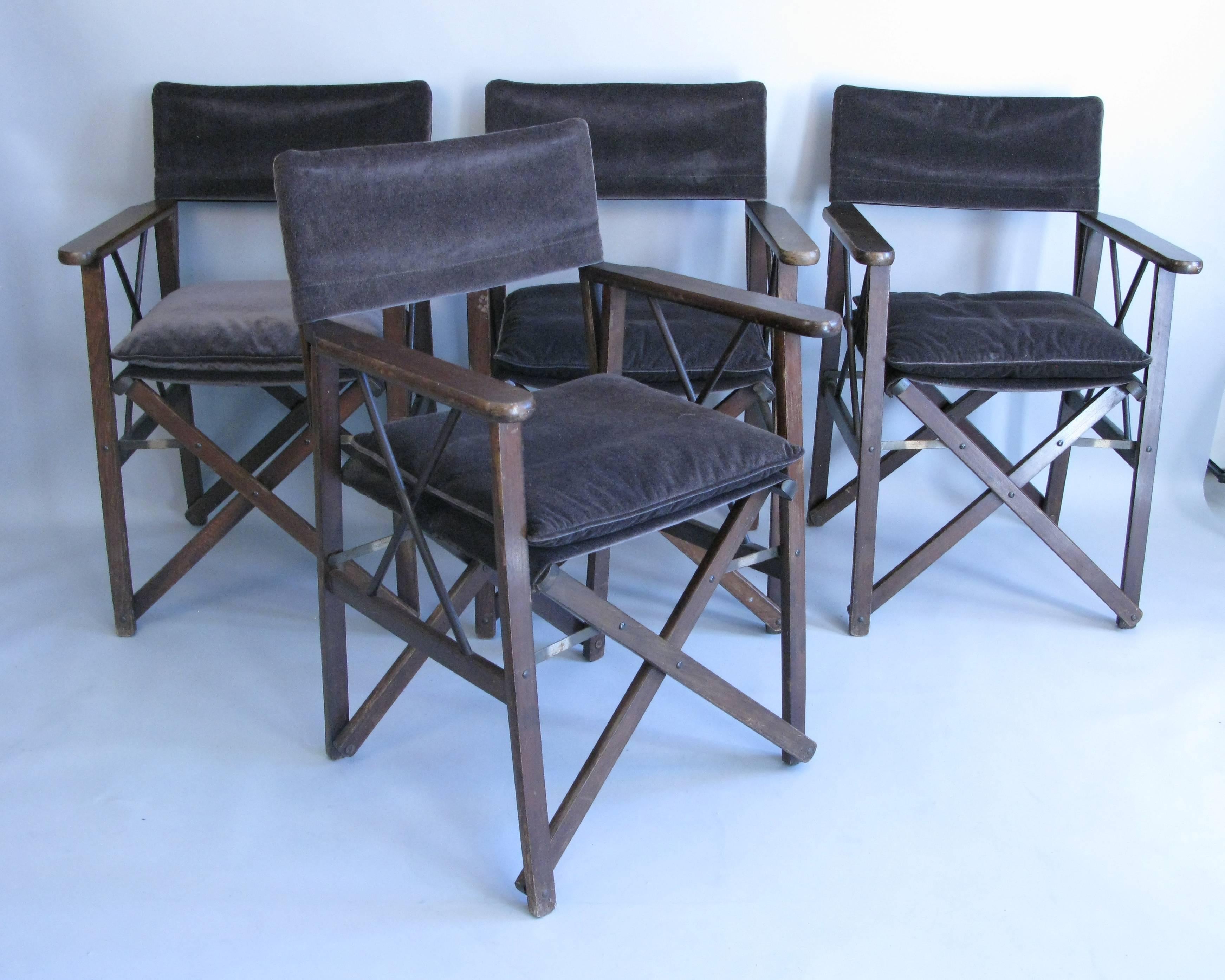 A wonderful set of 1940s folding pull up armchairs. The chairs are comfortable and can fold for storage. They have been upholstered in gray velvet fabric that is in great condition. The chairs are a good heavy weight and sturdy.