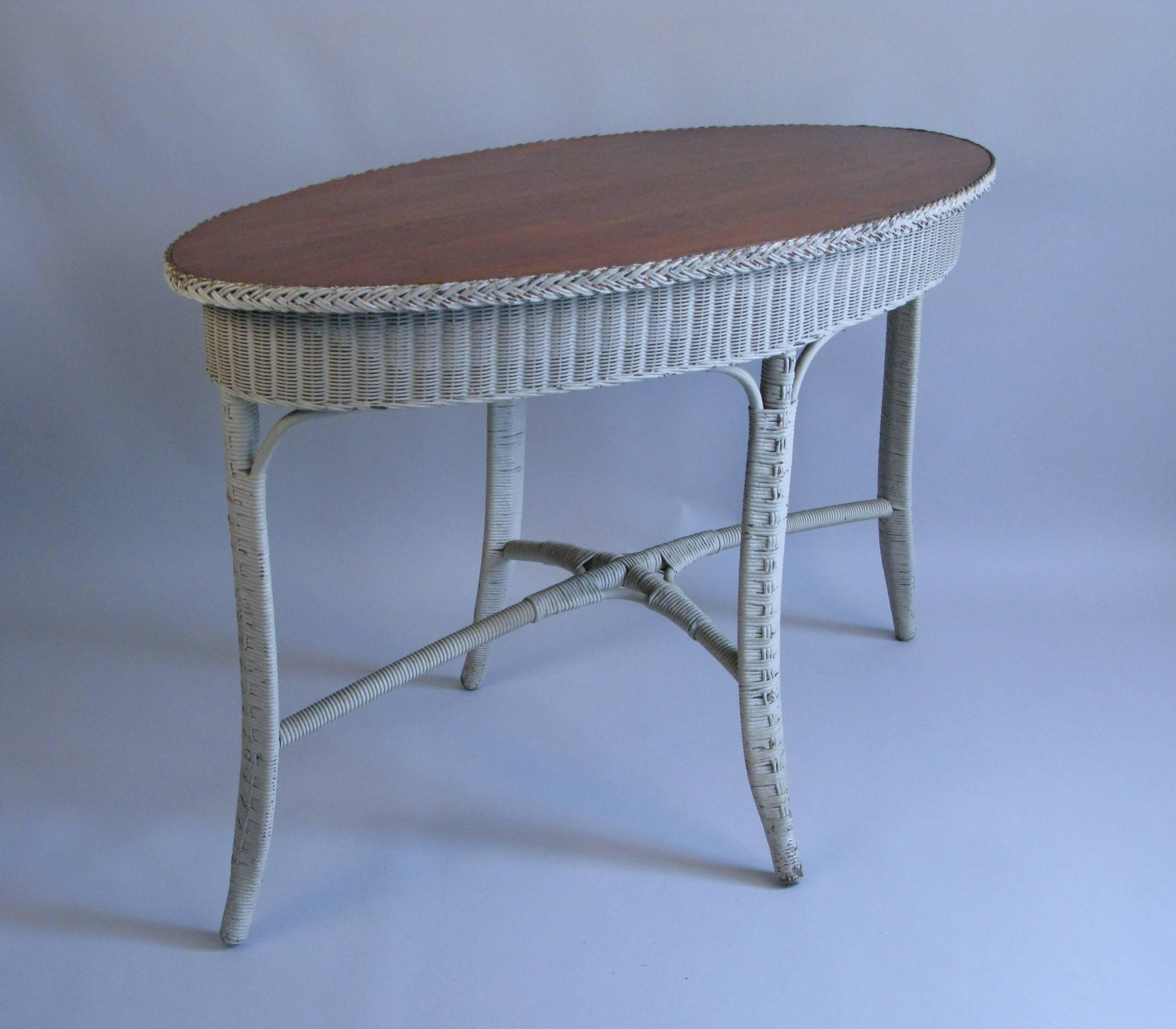 Charming wicker oval center table. Good size and very good condition.
There is a painted over Heywood Wakefield label.