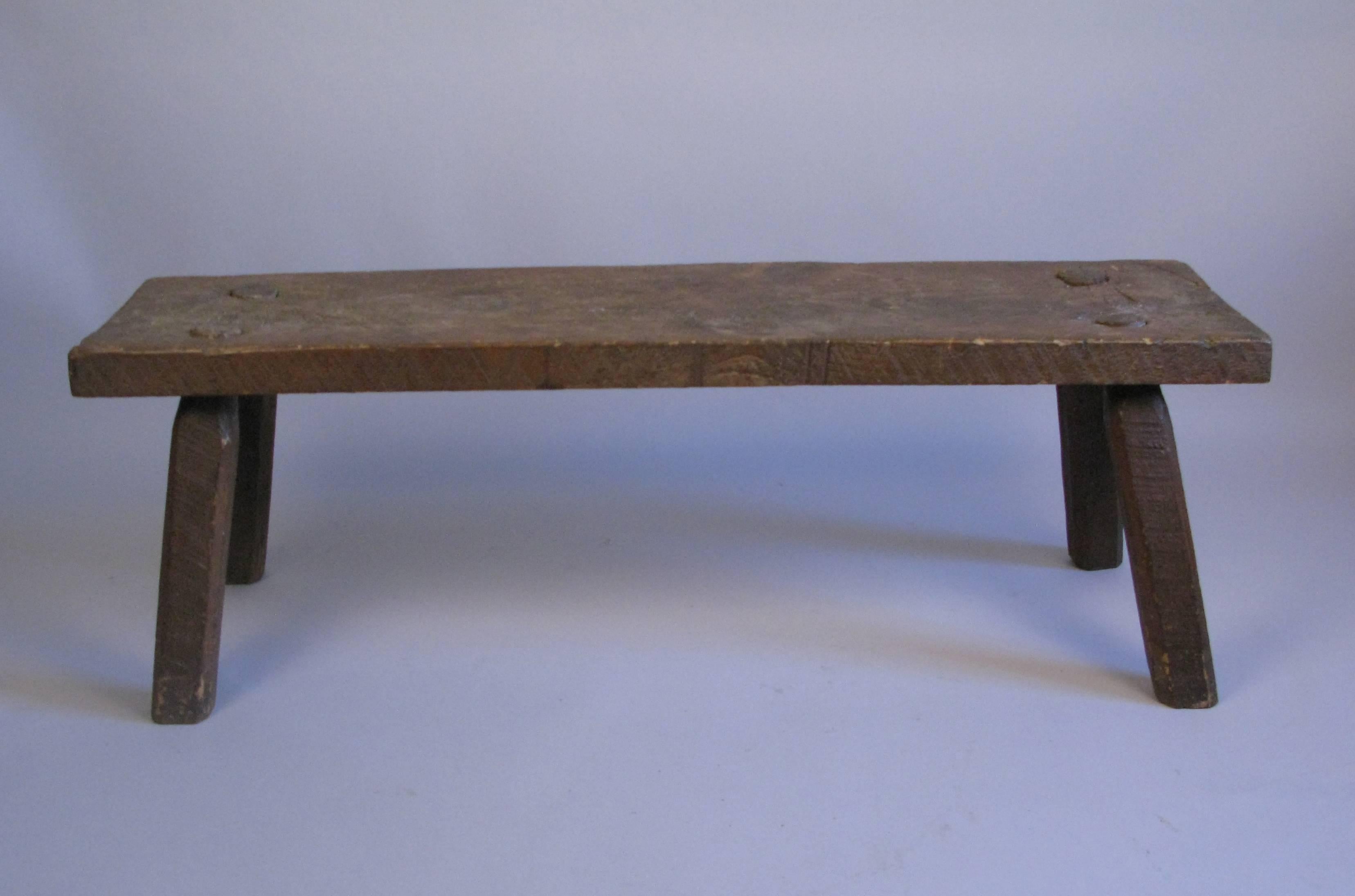 A handsome looking turn of the century handmade country bench. Bench is sturdy.