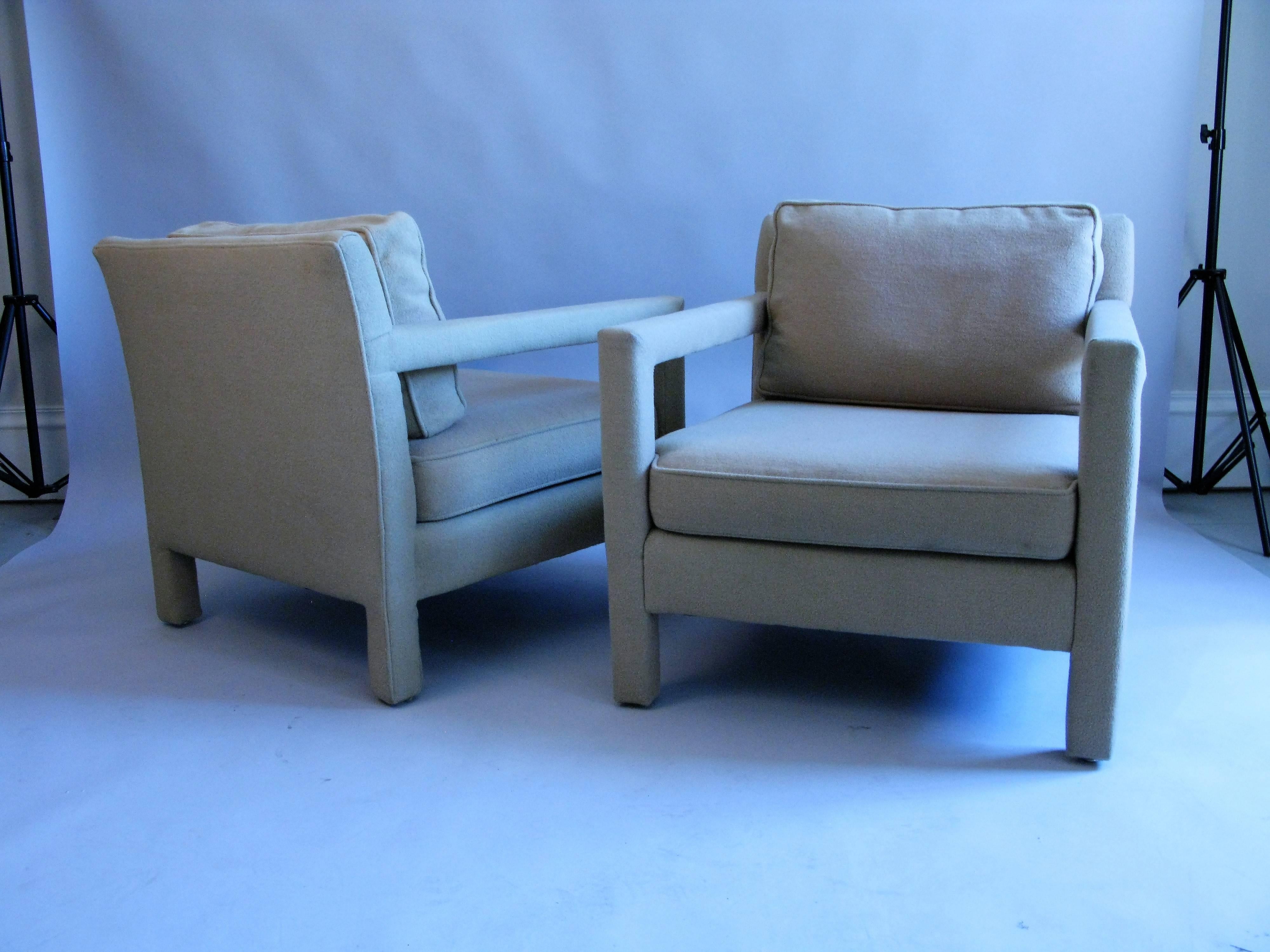 A very nice pair of comfortable upholstered Parsons chairs with wide and deep seats. The fabric is original cotton felt which is in very good condition, but has some discoloration from sun and use. The label is Bernhardt Furniture.