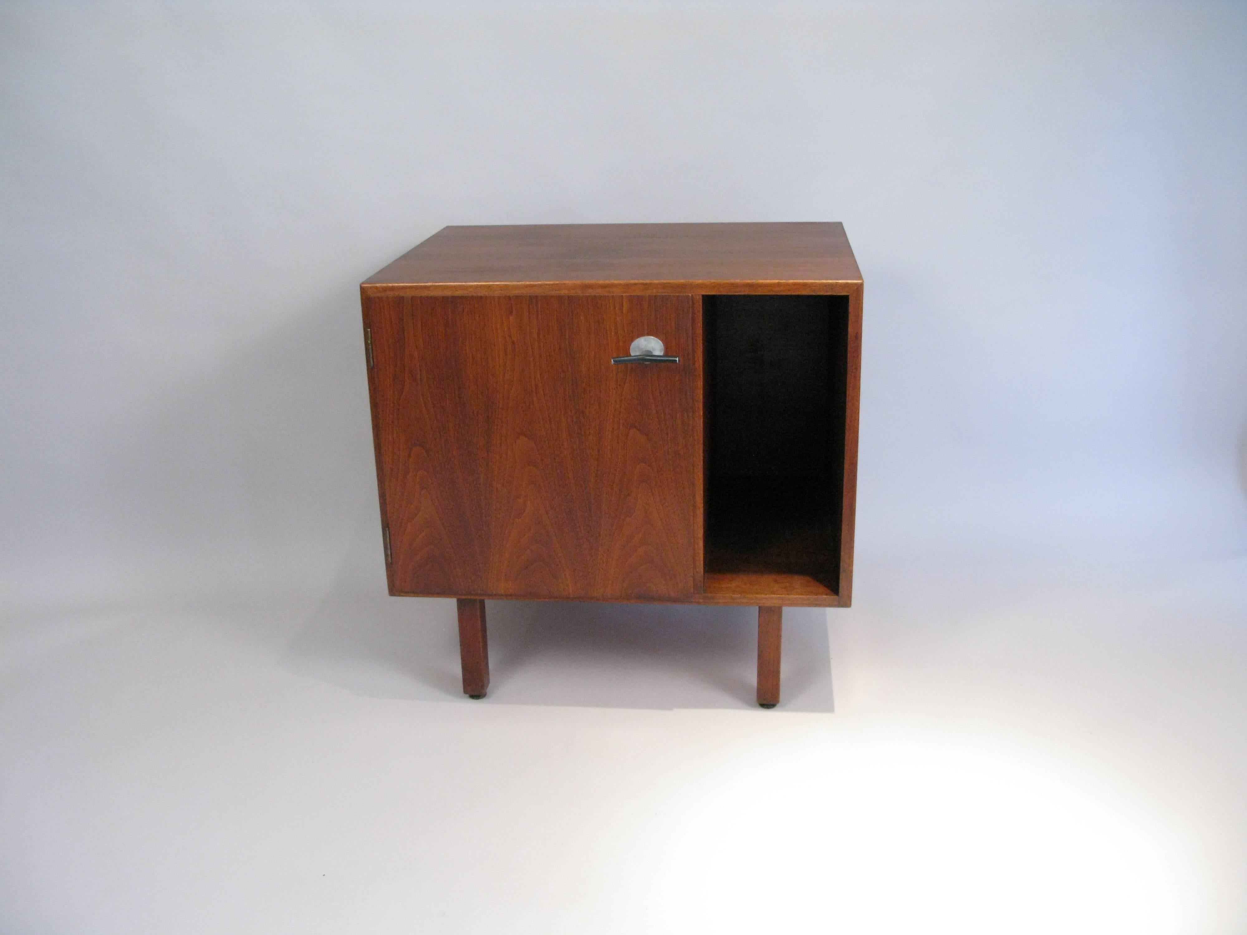 Midcentury 1960s walnut cabinet with storage designed by Jens Risom. Great for bedside. Finished on the back. The cabinet has been cleaned and polished.
