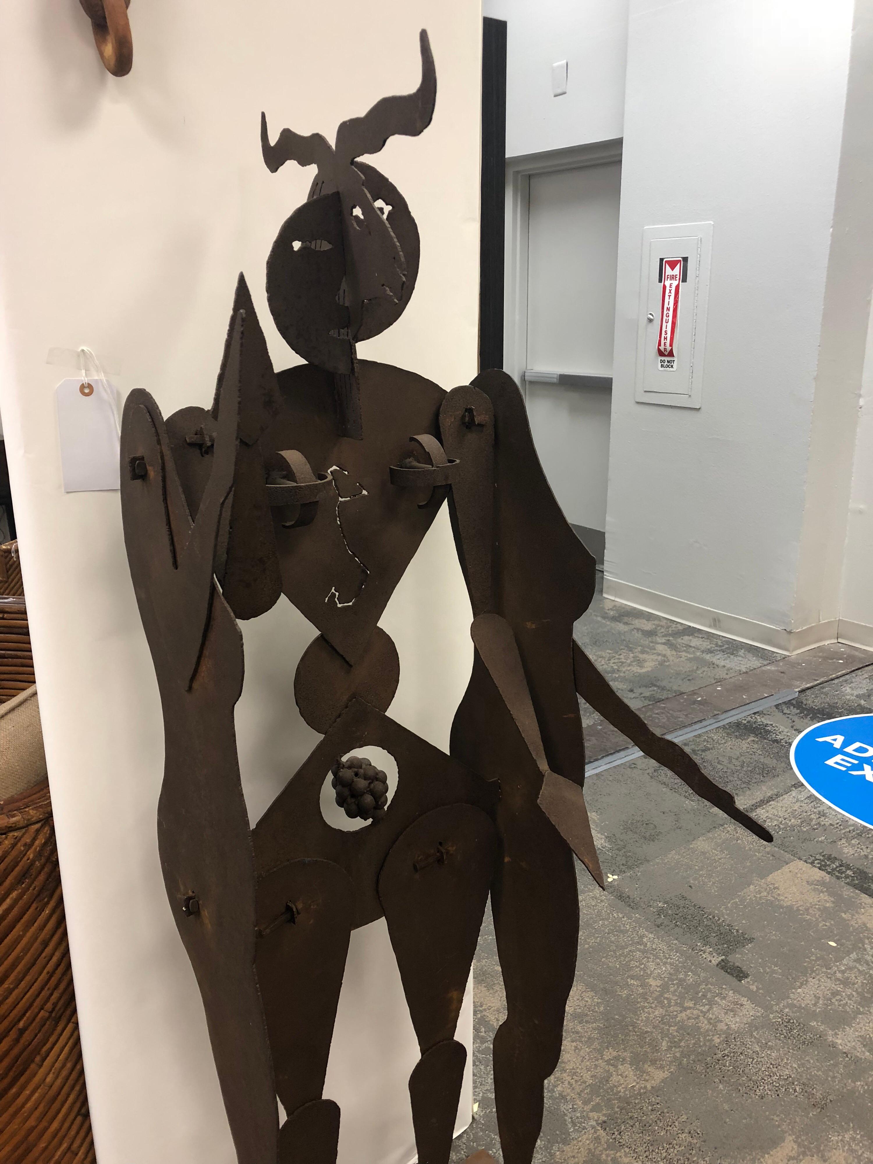 Modern figural metal sculpture by Allen Short. It is free standing. It is signed.