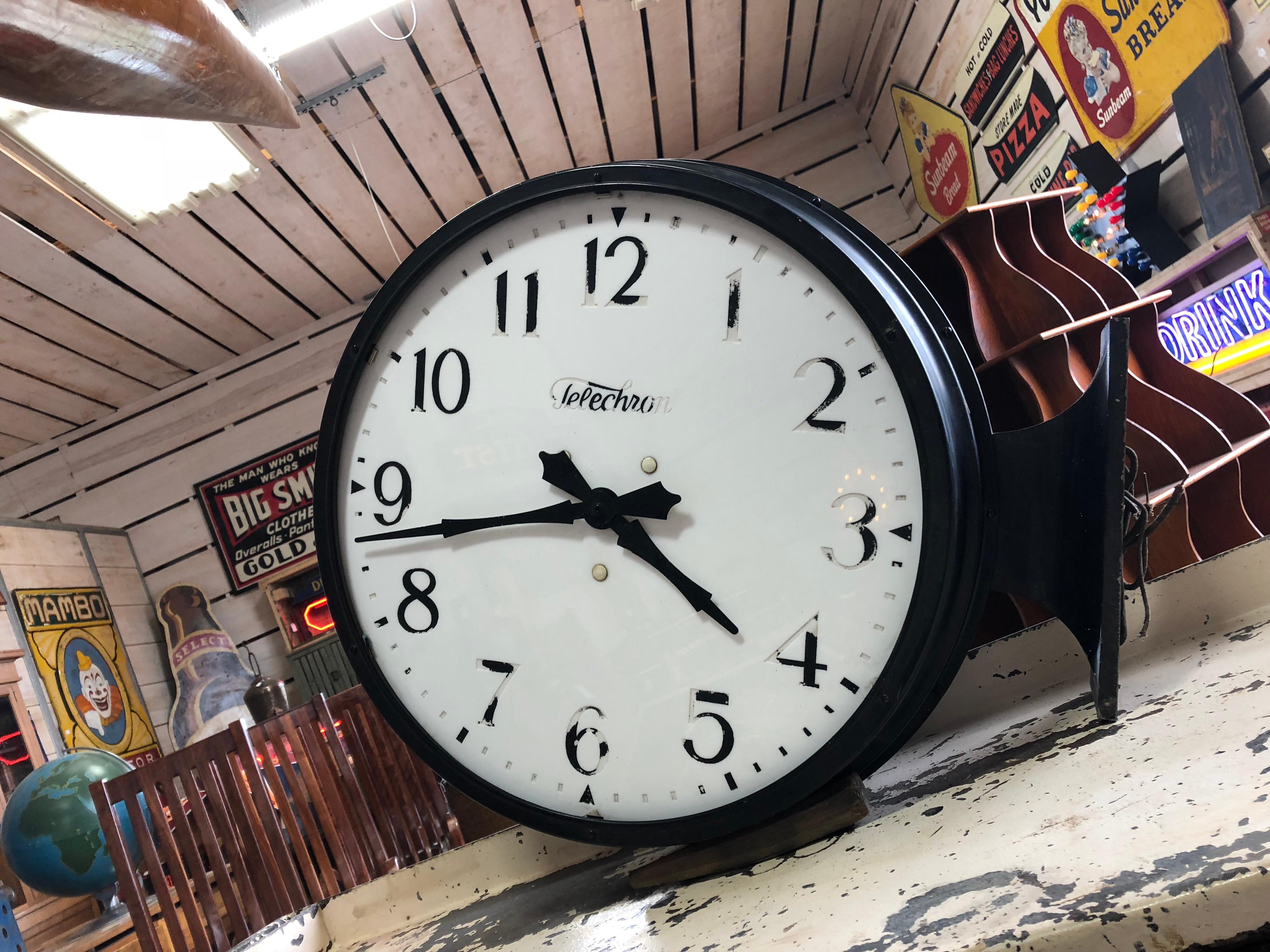 Antique double sided train station clock with milk glass faces by Telechron.