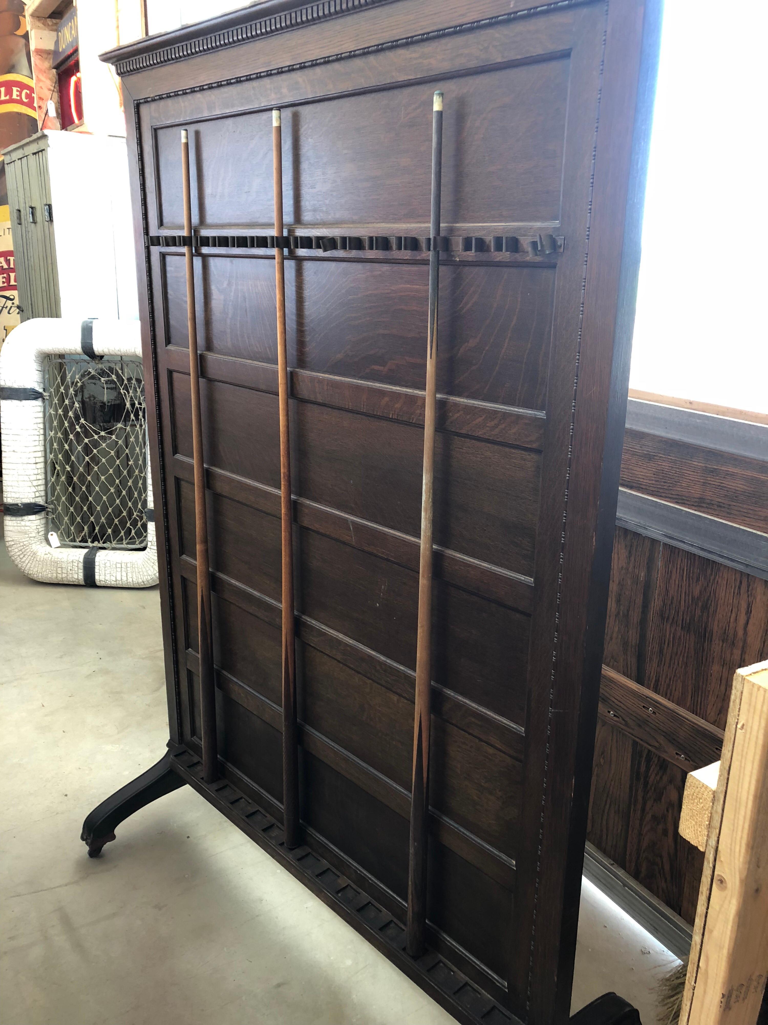 Antique Brunswick freestanding billiard rack. One side is cue rack and other has shelf for drinks.