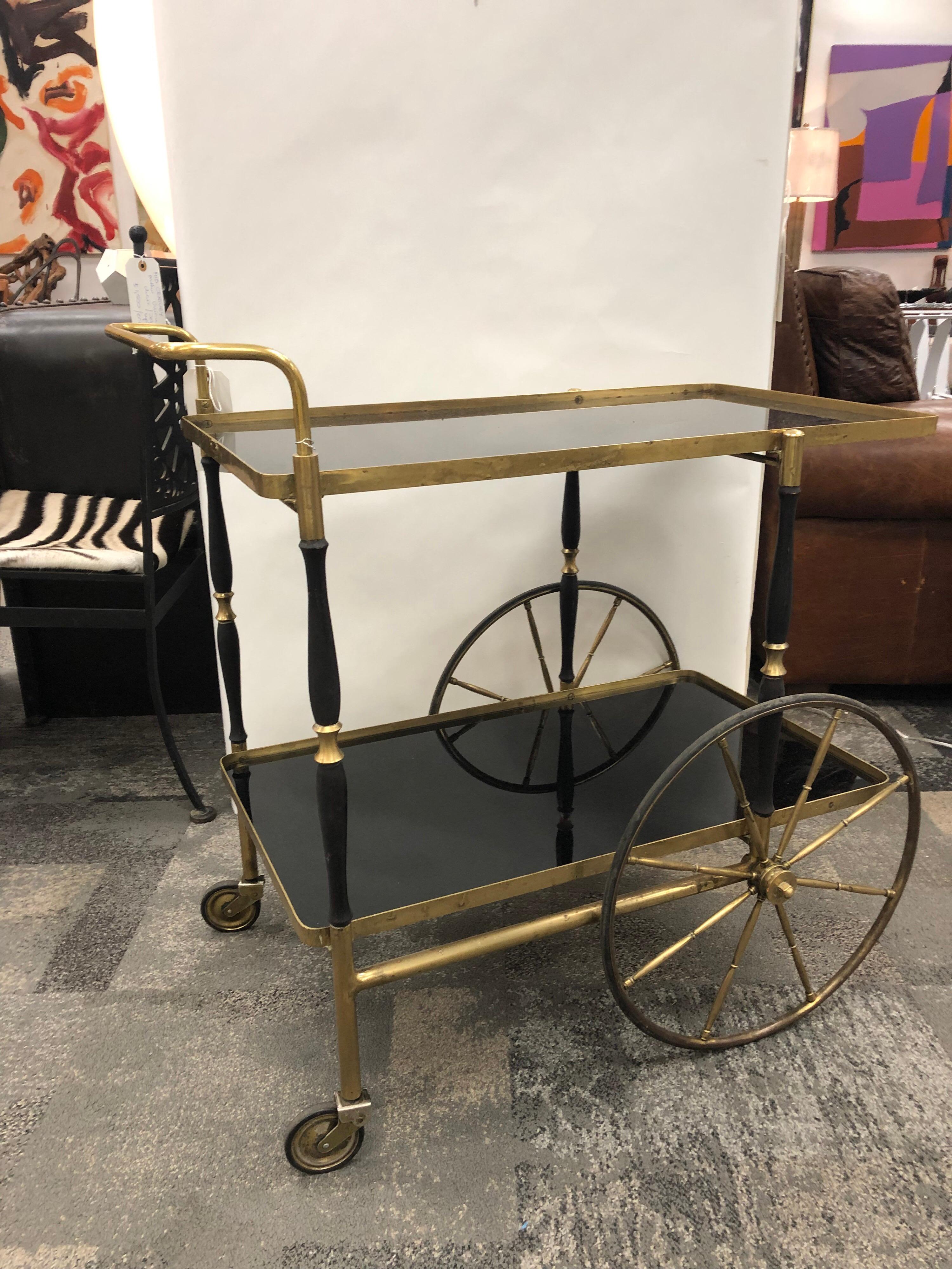 Midcentury Italian brass bar cart by Morex with black glass tops. Each top is 28.25” by 16”.