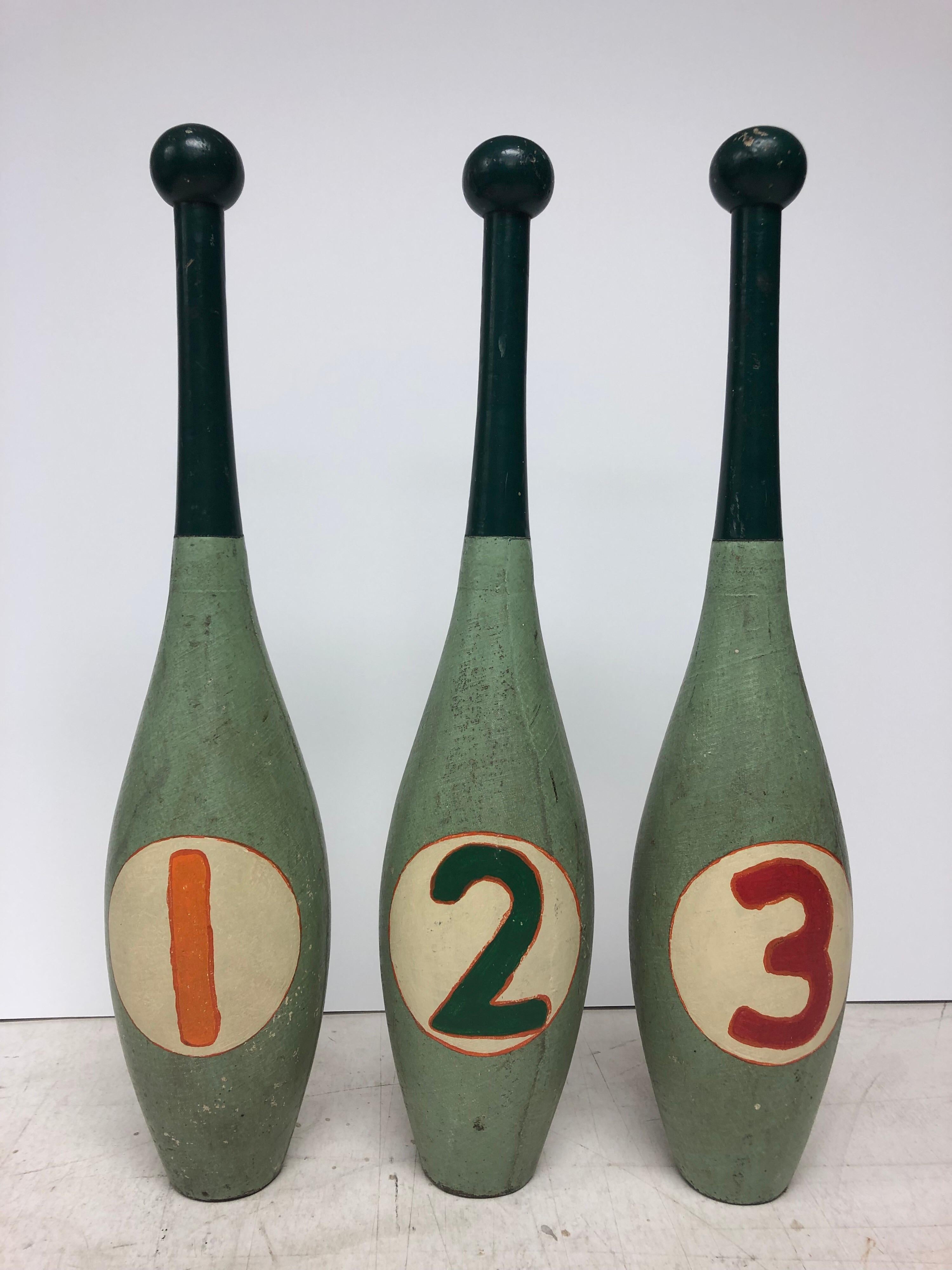 Vintage hand painted juggling pins. Set of 3.