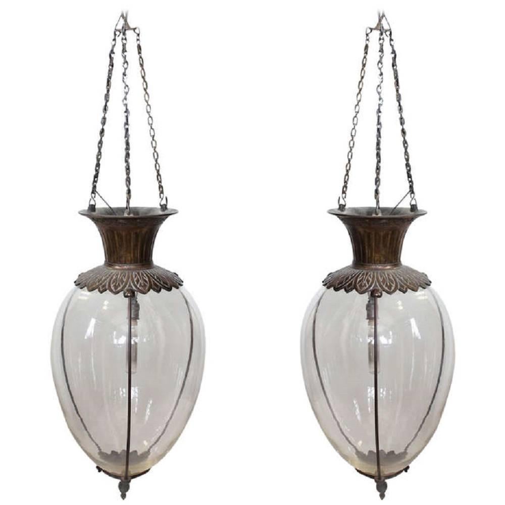 Pair of spectacular large antique drugstore glass and bronze show globes chandeliers. Adjustable height. Newly rewired.