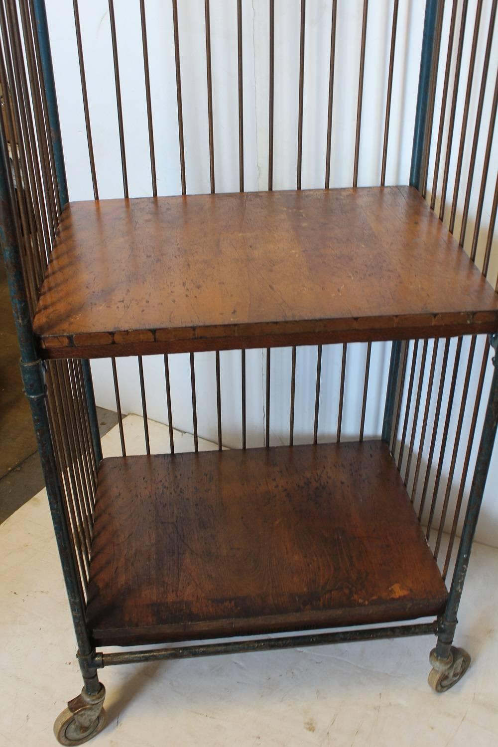 Antique industrial metal bindery cart with wood shelves. We have three available.