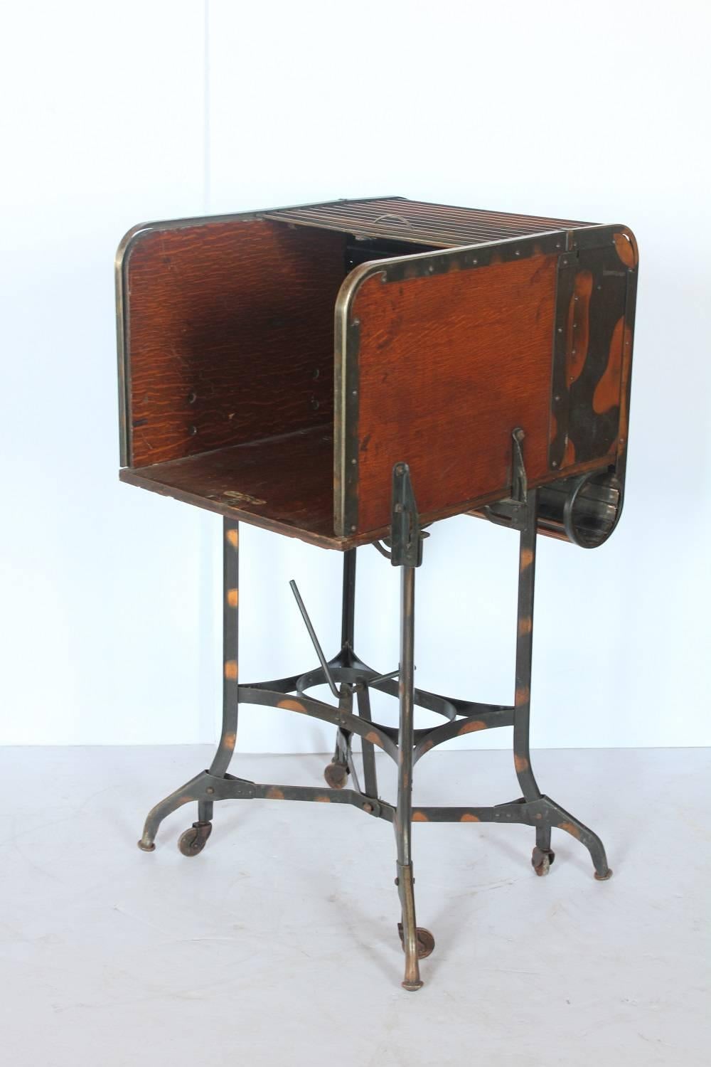 Early 1900s American Industrial roll top table by Toledo. Great as used as bar.