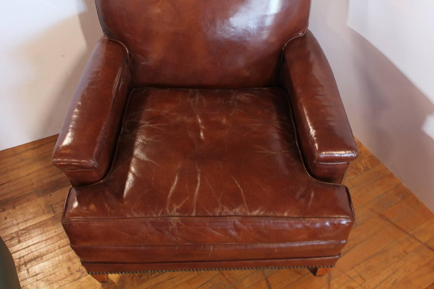 Antique leather club chair.