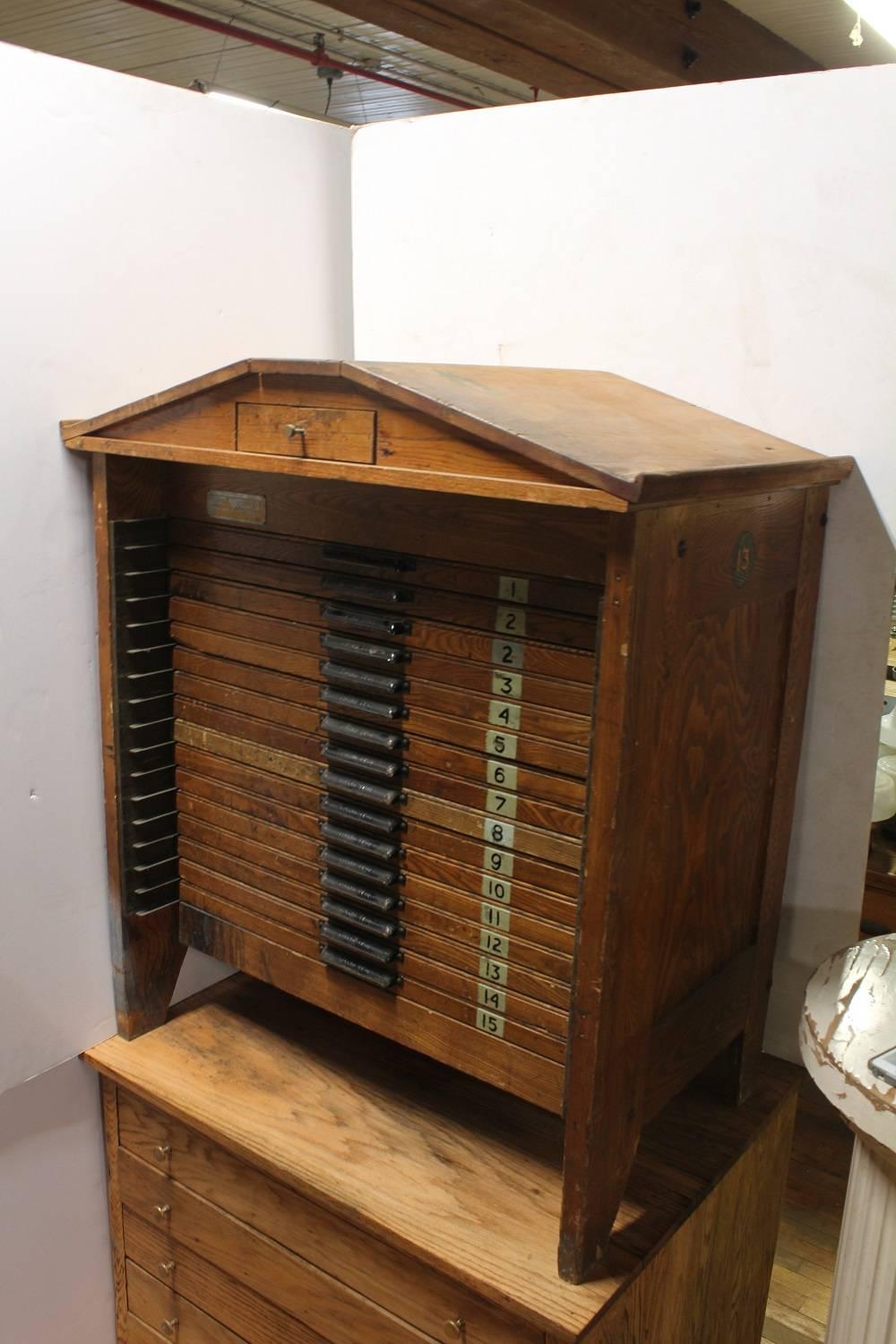 Unusual printers wood table/cabinet by Hamilton.