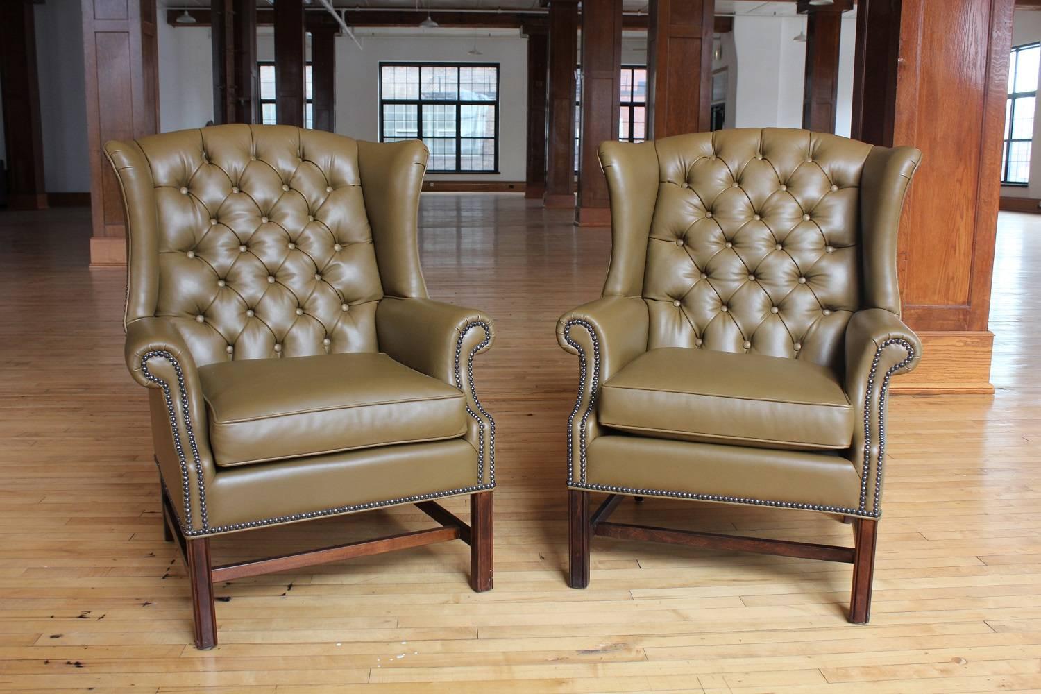 1920s American Library Tufted Leather Wing Chair. New upholstery. Listed price is for one chair.