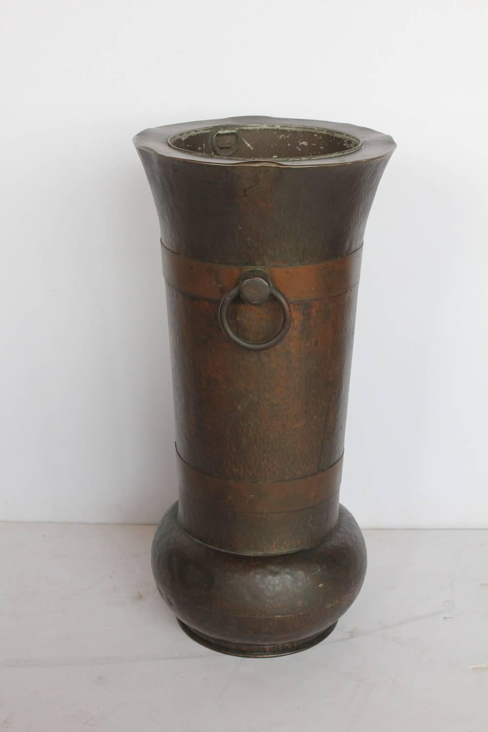 Large antique American hand-hammered copper umbrella stand.