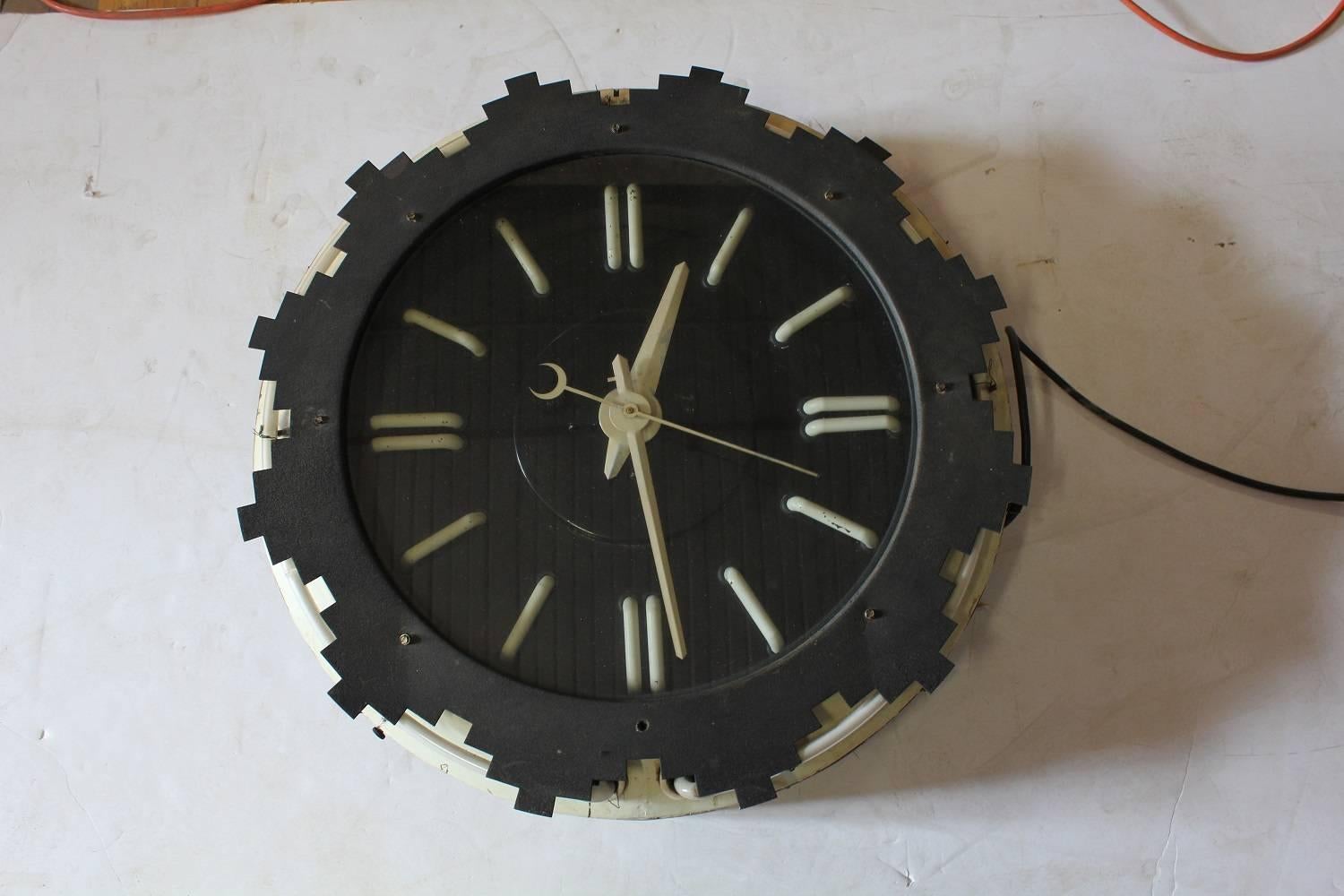 Rare Art Deco Aztec neon wall clock.
