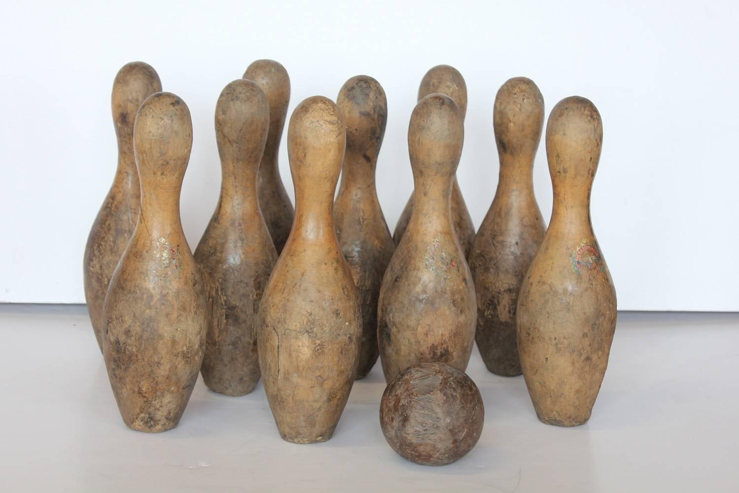 Antique Bowling Set. It includes 10 pins and one ball