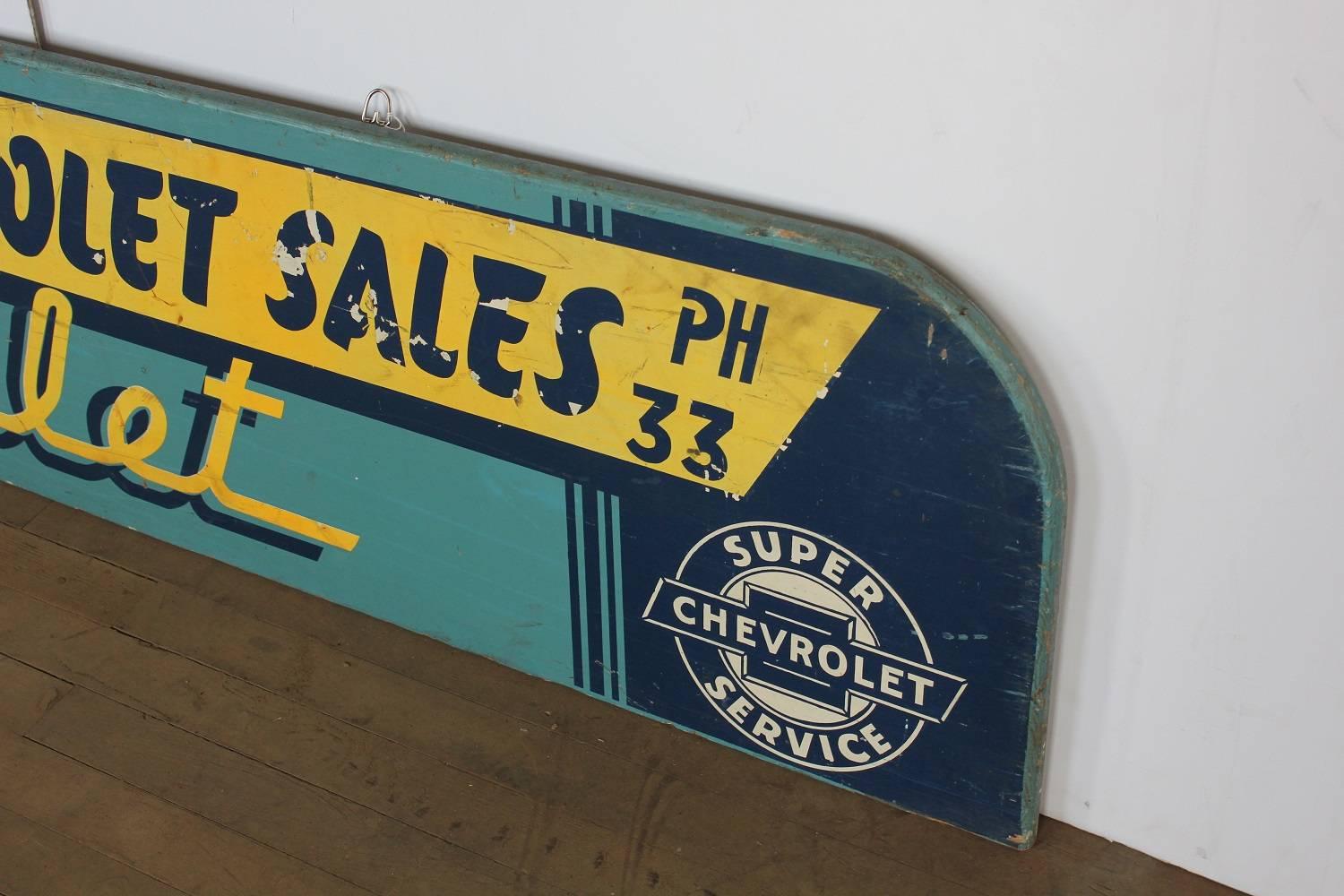1930s hand-painted wood Chevrolet advertising sign.