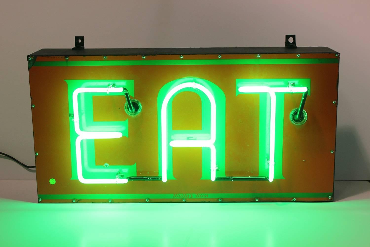 Vintage American enamel and neon EAT sign.